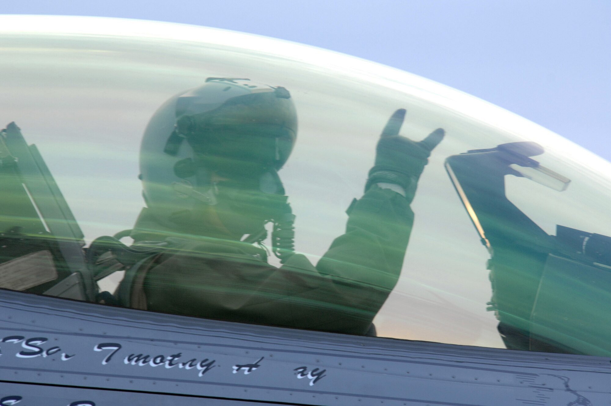 EIELSON AIR FORCE BASE, Alaska -- An F-16 Fighting Falcon pilot from the 18th Fighter Squadron signals from his aircraft prior to taking off for a training mission here on Feb.8. The 18th Fighter Squadron conducts air operations for combat-ready F-16 aircraft and provides close air support, forward air control (airborne), battlefield air interdiction, and offensive counter air.
(U.S. Air Force Photo by Staff Sgt Joshua Strang)
