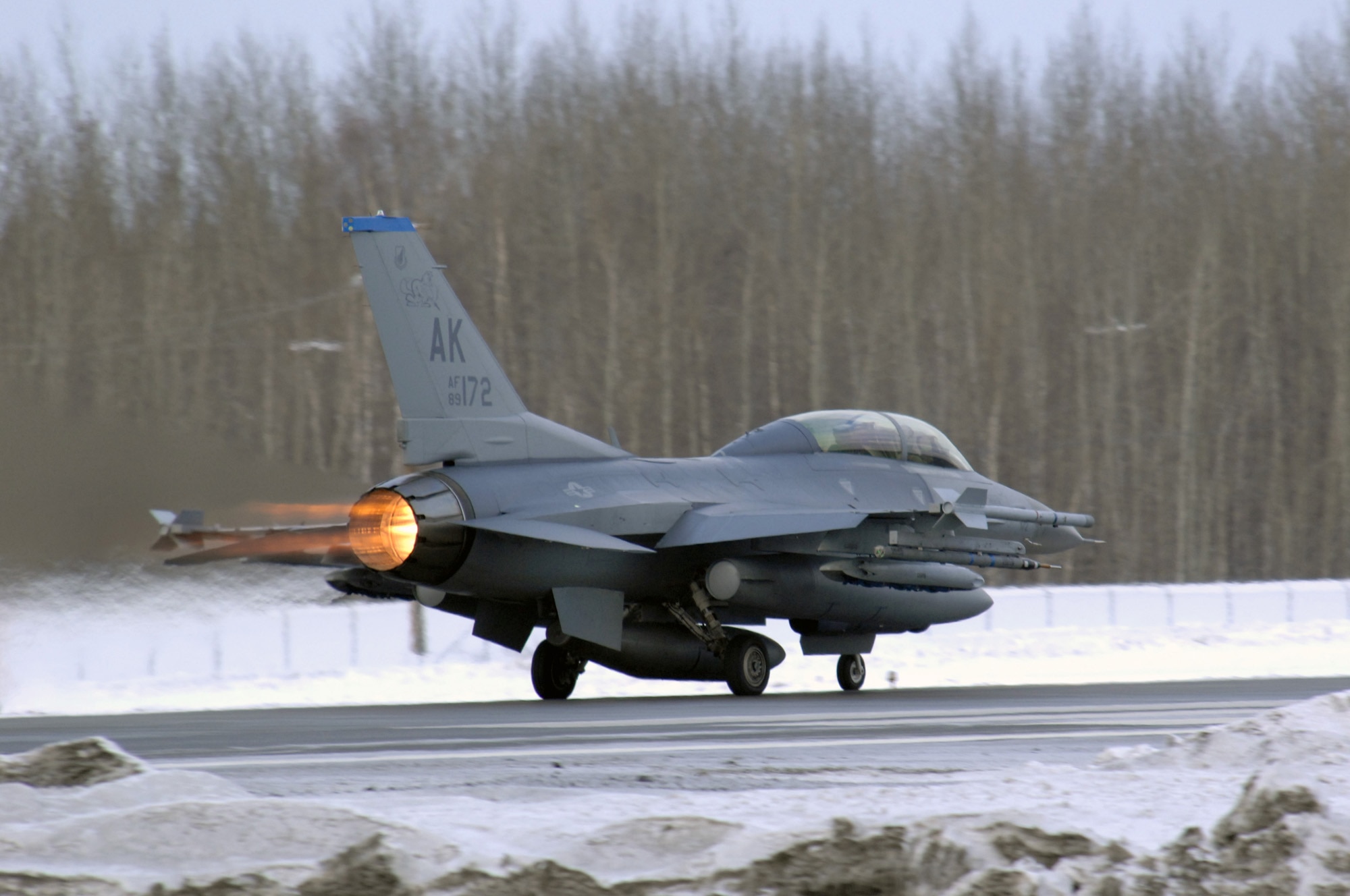 EIELSON AIR FORCE BASE, Alaska -- An F-16D Fighting Falcon aircraft from the 18th Fighter Squadron takes off from the flightline here for a training mission on Feb.8. The 18th Fighter Squadron conducts air operations for combat-ready F-16 aircraft and provides close air support, forward air control (airborne), battlefield air interdiction, and offensive counter air.
(U.S. Air Force Photo by Staff Sgt Joshua Strang)