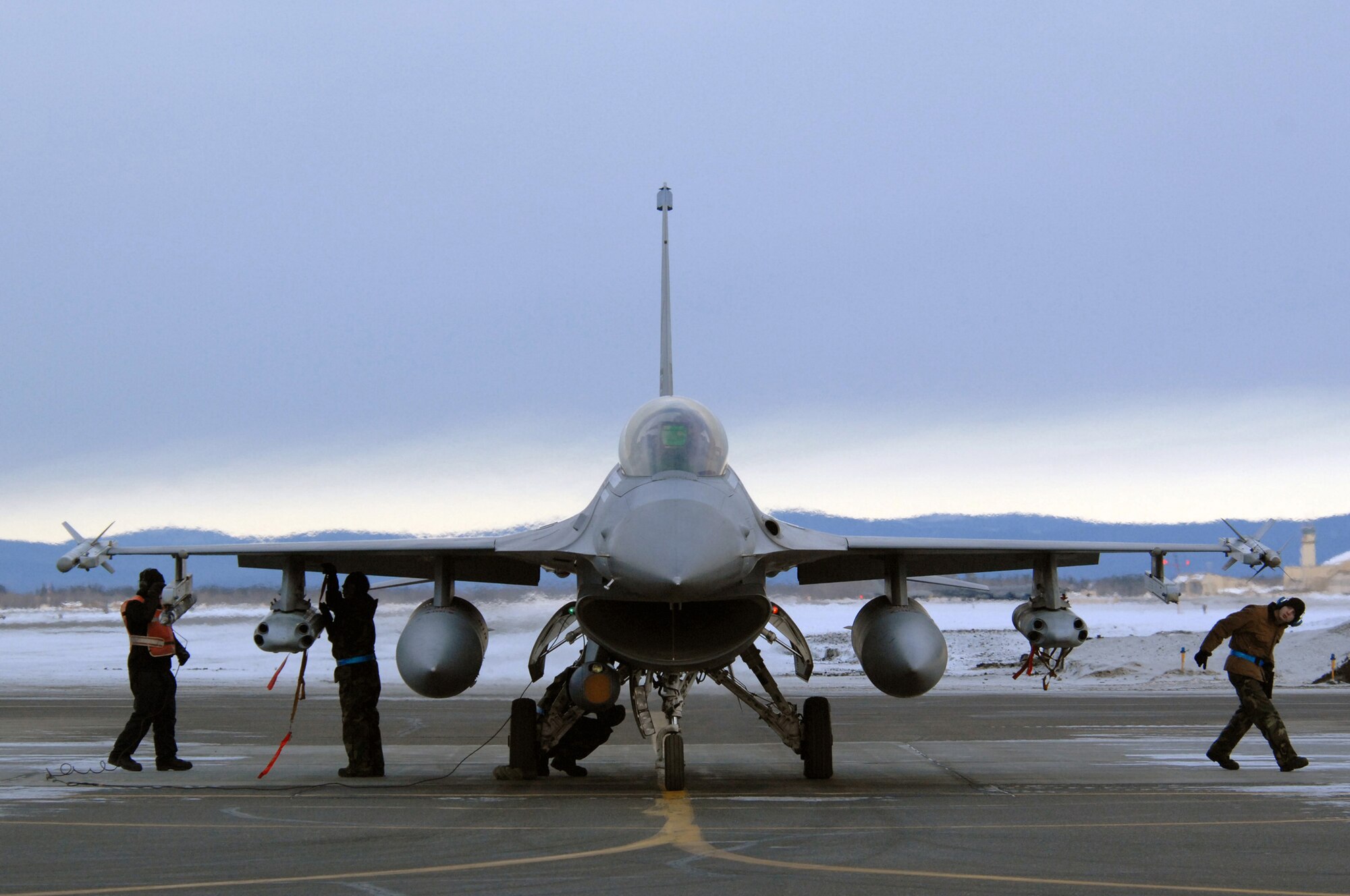 EIELSON AIR FORCE BASE, Alaska -- A 354th Aircraft Maintenance Squadron End of Runway crew arms and inspects an F-16C Fighting Falcon here on Feb. 8. The crew is responsible for arming all weapons and making sure the aircraft is ready for flight. The F-16 is assigned to the 18th Fighter Squadron. The 18th Fighter Squadron conducts air operations for combat-ready F-16 aircraft and provides close air support, forward air control (airborne), battlefield air interdiction, and offensive counter air.
(U.S. Air Force Photo by Staff Sgt Joshua Strang)