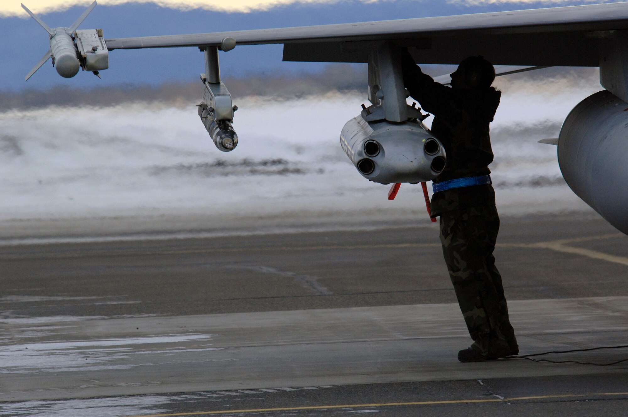 EIELSON AIR FORCE BASE, Alaska -- Senior Airman Amanda Debkowski, 354th Aircraft Maintenance Squadron, arms an F-16C Fighting Falcon as a part of a End of Runway crew here on Feb. 8. The crew is responsible for arming all weapons and making sure the aircraft is ready for flight. The F-16 is assigned to the 18th Fighter Squadron. The 18th Fighter Squadron conducts air operations for combat-ready F-16 aircraft and provides close air support, forward air control (airborne), battlefield air interdiction, and offensive counter air.
(U.S. Air Force Photo by Staff Sgt Joshua Strang)