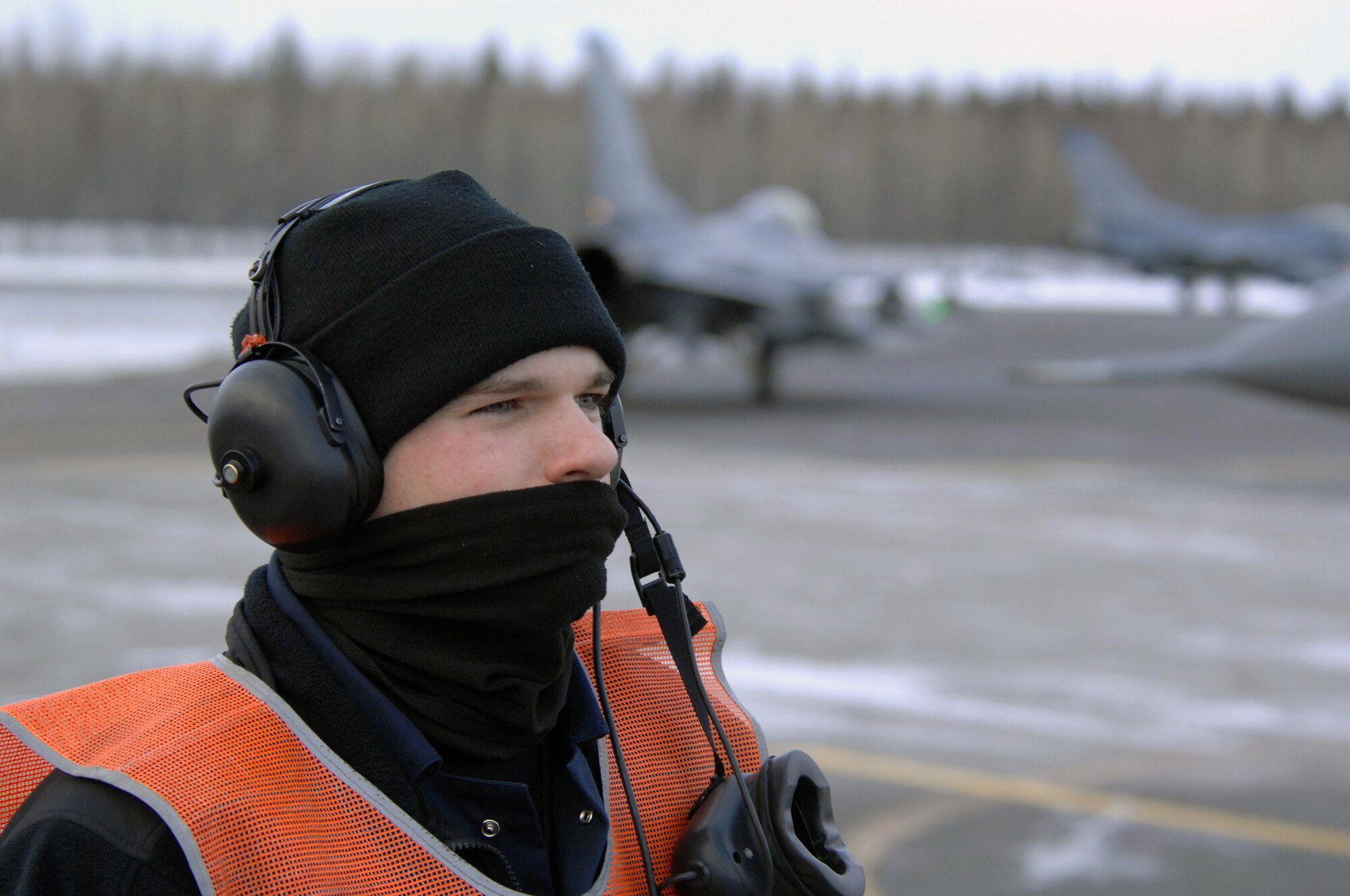 EIELSON AIR FORCE BASE, Alaska -- Staff Sgt Theodore Marx, 354th Aircraft Maintenance Squadron, looks on as an F-16C Fighting Falcon is armed during End of Runway (EOR) duties here on Feb. 8. The EOR crew is responsible for arming all weapons and making sure the aircraft is ready for flight. The F-16 is assigned to the 18th Fighter Squadron. The 18th Fighter Squadron conducts air operations for combat-ready F-16 aircraft and provides close air support, forward air control (airborne), battlefield air interdiction, and offensive counter air.
(U.S. Air Force Photo by Staff Sgt Joshua Strang)