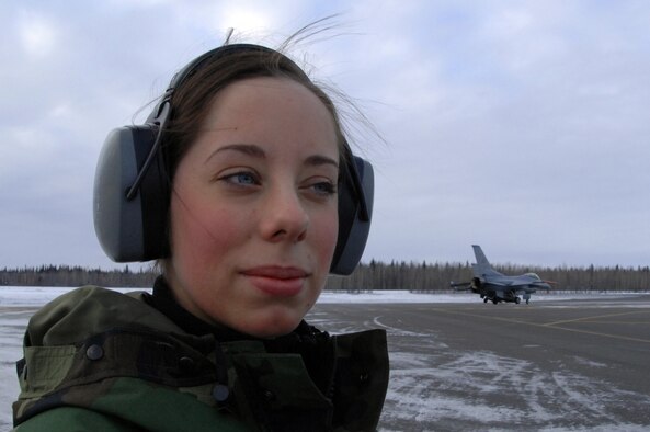 EIELSON AIR FORCE BASE, Alaska -- Senior Airman Amanda Debkowski, 354th Aircraft Maintenance Squadron, watches on as F-16 Fighting Falcon aircraft approach the End of Runway crew here on Feb. 8. The crew is responsible for arming all weapons and making sure the aircraft is ready for flight. The F-16 is assigned to the 18th Fighter Squadron. The 18th Fighter Squadron conducts air operations for combat-ready F-16 aircraft and provides close air support, forward air control (airborne), battlefield air interdiction, and offensive counter air.
(U.S. Air Force Photo by Staff Sgt Joshua Strang)