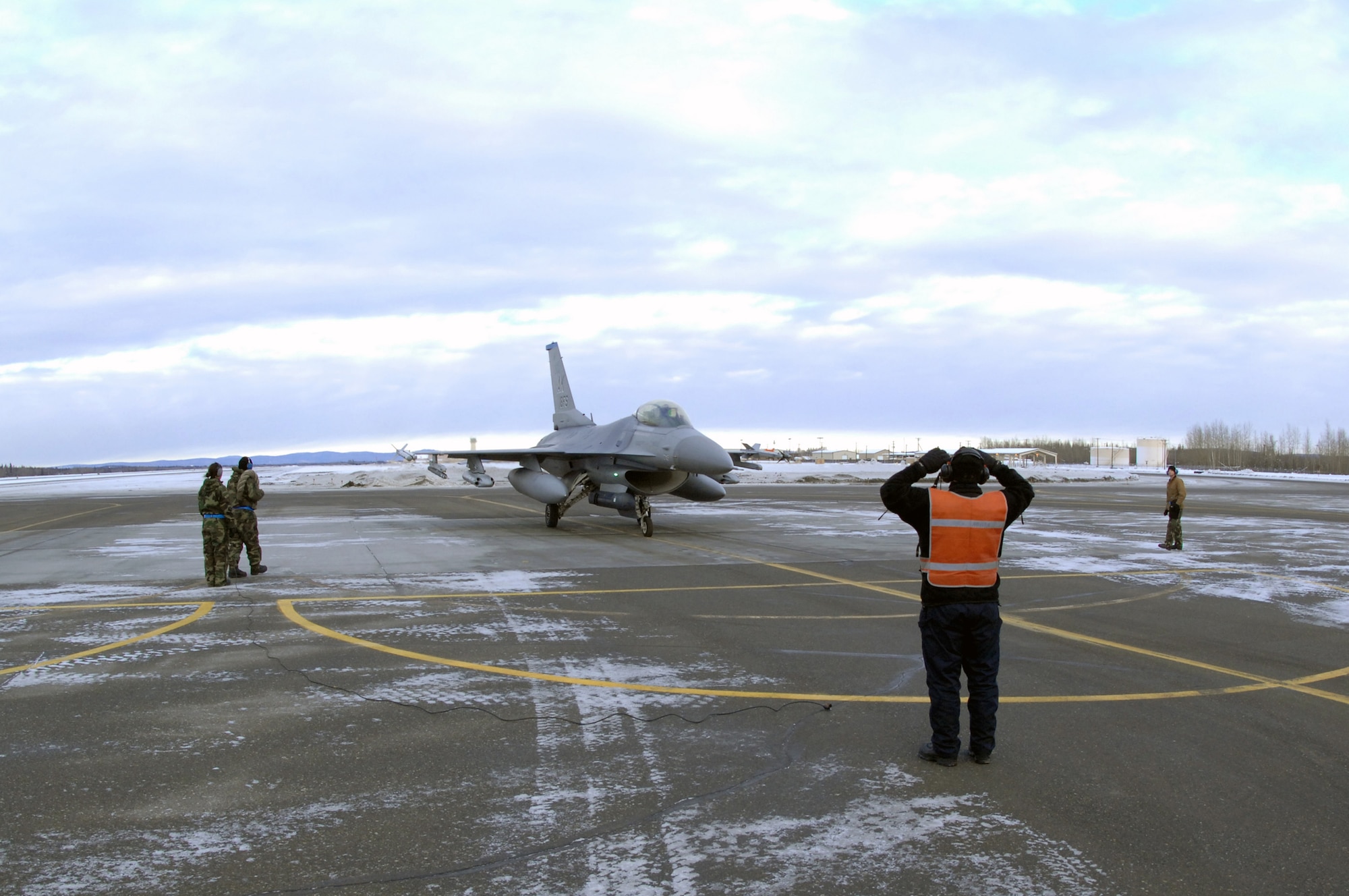 EIELSON AIR FORCE BASE, Alaska -- A 354th Aircraft Maintenance Squadron End of Runway crew receives an F-16C Fighting Falcon here on Feb. 8. The crew is responsible for arming all weapons and making sure the aircraft is ready for flight. The F-16 is assigned to the 18th Fighter Squadron. The 18th Fighter Squadron conducts air operations for combat-ready F-16 aircraft and provides close air support, forward air control (airborne), battlefield air interdiction, and offensive counter air.
(U.S. Air Force Photo by Staff Sgt Joshua Strang)