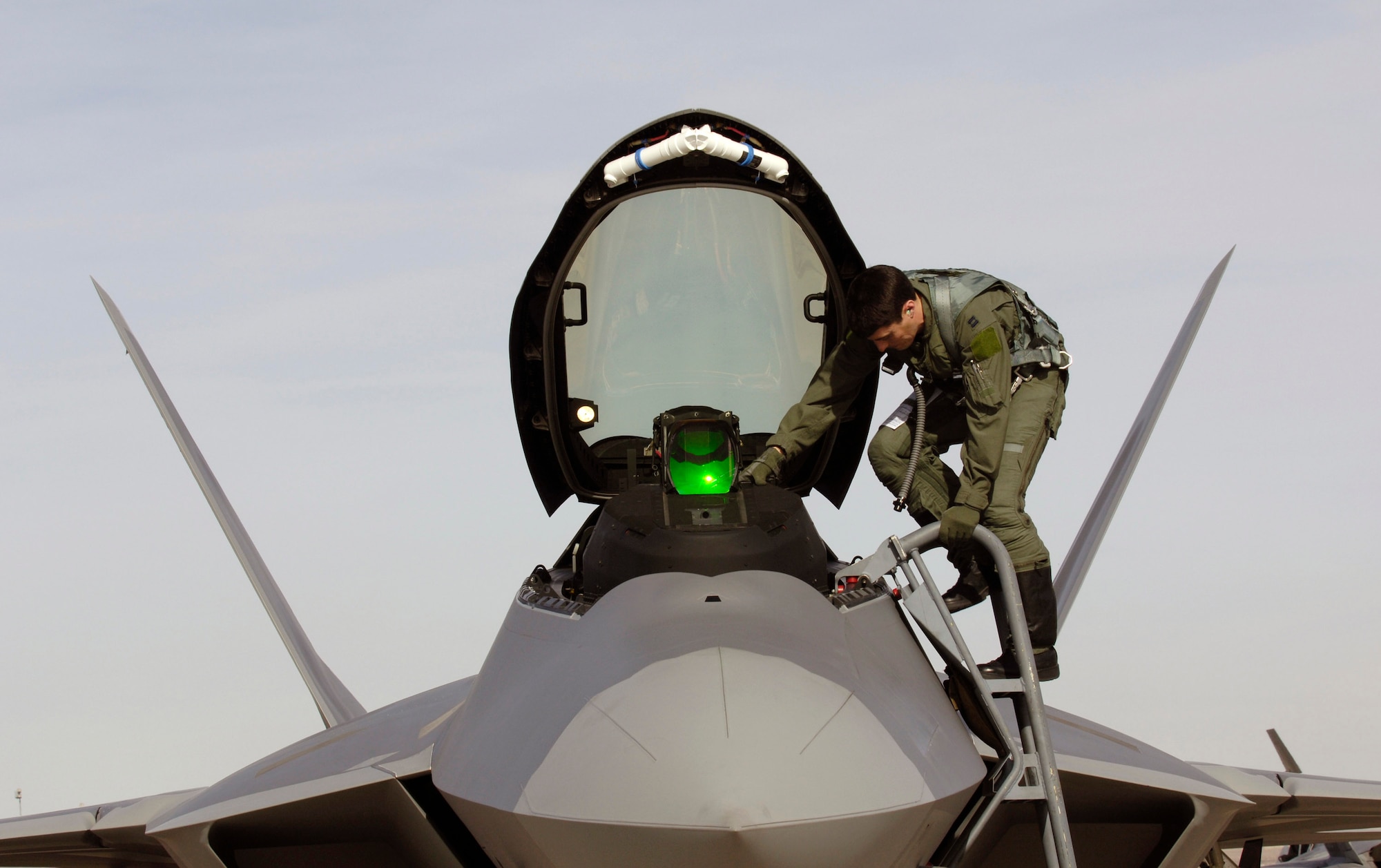 Capt. Raymond Thaler exits an F-22 Raptor after a sortie during Red Flag 07-02 Feb. 6 at Nellis Air Force Base, Nev. Red Flag sharpens aircrews' warfighting skills in realistic combat situations. The F-22s will be flying missions during the day and night to the nearby Nevada Test and Training Range where they will simulate an air war. The Air Force and Navy, along with military forces from Australia and the United Kingdom, are participating in Red Flag. Captain Thaler is an F-22 pilot with the 94th Fighter Squadron at Langley Air Force Base, Va. This is the first deployment to Red Flag for the 94th FS with the F-22. (U.S. Air Force photo/Master. Sgt. Kevin J. Gruenwald) 
