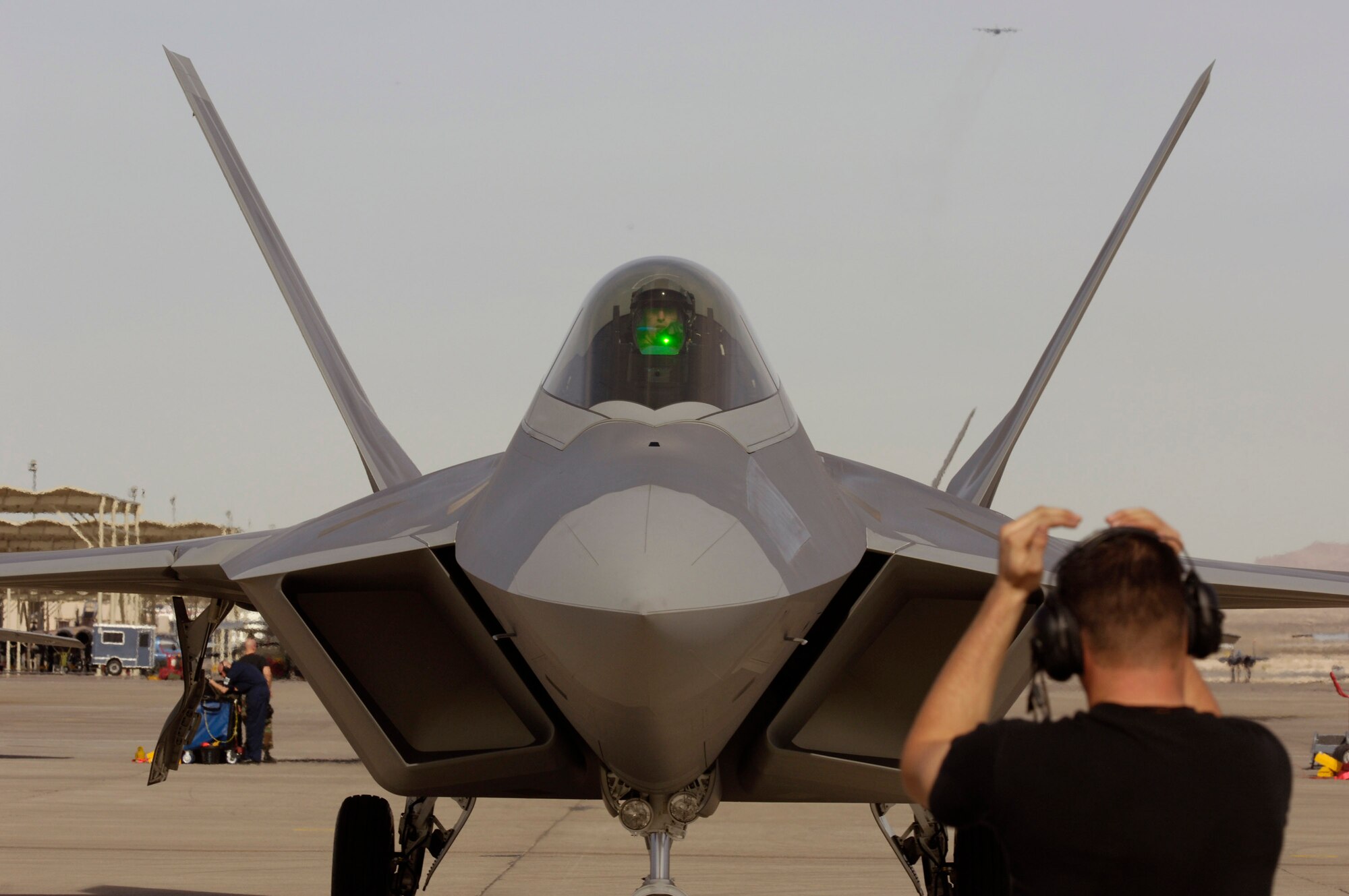 Senior Airman William Rotroff taxies in a F-22 Raptor during Red Flag 07-02 Feb. 6 at Nellis Air Force Base, Nev. Red Flag sharpens aircrews' warfighting skills in realistic combat situations. The F-22 will be flying missions during the day and night to the nearby Nevada Test and Training Range where they will simulate an air war. The Air Force and Navy, along with military forces from Australia and the United Kingdom, are participating in Red Flag. Airman Rotroff is a tactical aircraft maintenance specialist with the 94th Fighter Squadron at Langley Air Force Base, Va. This is the first deployment to Red Flag for the 94th FS with the F-22. (U.S. Air Force photo/Master. Sgt. Kevin J. Gruenwald) 
