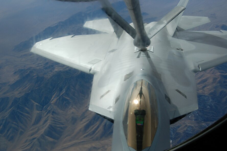 An F-22A Raptor from the 1st Fighter Wing at Langley Air Force Base, Va., tops off from a Grand Forks Air Force Base KC-135 Feb. 7 during the Red Flag Exercise at Nellis AFB, Nev. Two KC-135 Stratotankers from the 319th Air Refueling Wing are the lead tanker unit during the exercise.  (U.S. Air Force photo/1st Lt. Randi Norton)