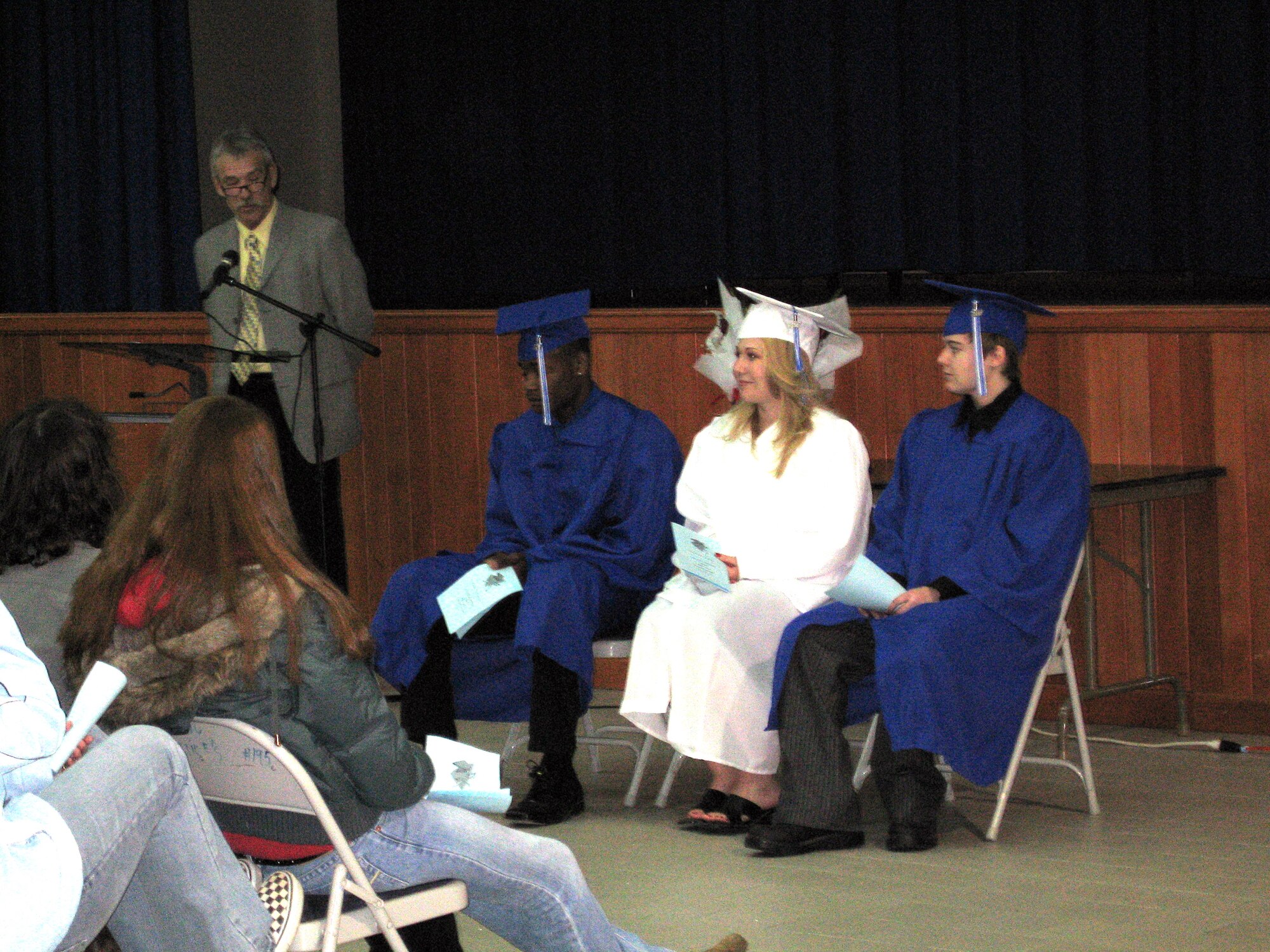 Neil Bacon, Incirlik American School social studies teacher, makes the inspritianal  remarks during the mid-year commencement ceremony honoring three 2007 graduates Feb. 7. Jeffrey Douglas McWaine, Nicole Marie Smith and Kristen Lynn Stamper all received diplomas and ended their high school education. (U.S. Air Force Photo by Senior Airman Patrice Clarke)