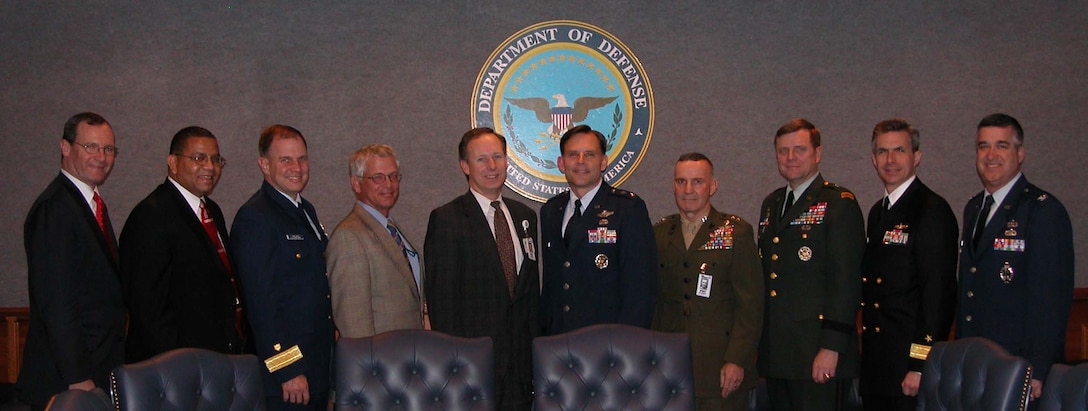 From the left: John Allison, chief training officer, Defense 
Intelligence Agency; retired Air Force Brig. Gen. Frank Anderson, president, 
Defense Acquisition University; Rear Adm. James Van Sice, director of reserve 
and training, U.S. Coast Guard; Daniel E. Gardner, director, readiness and 
training, policy and programs; Paul W. Mayberry, deputy undersecretary of 
defense for readiness; Air Force Maj. Gen. Jack J. Catton Jr., director, 
operational plans and joint force development, Joint Staff J-7; Maj. Gen. 
Thomas S. Jones, commanding general of Training and Education Command, Marine 
Corps Combat Development Command; Brig. Gen. Louis W. Weber, director of 
training, Army G-3; Rear Adm. Jamie Barnett, deputy director of Naval Education 
and Training; and Col. James Hollingsworth, Chief, Training training and 
Requirements Division, U.S. Air Force, pose at the Joint Knowledge Development 
and Distribution Capability demonstration at the Pentagon Feb. 22. Photo by 
Ger