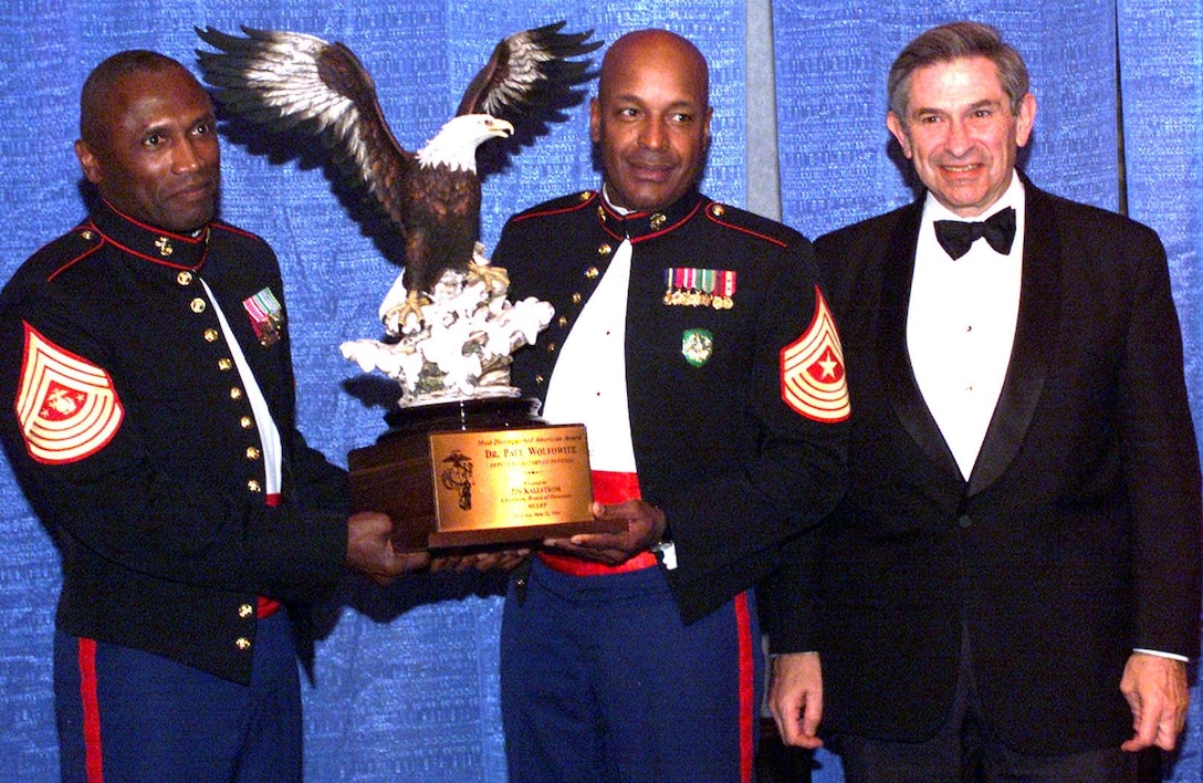 Deputy Defense Secretary Paul Wolfowitz, right, makes a point 
with Sgt. Maj. of the Marine Corps John L. Estrada, left, and the Corps former 
Sgt. Maj. Alford L. McMichael, who is now the senior noncommissioned officer of 
Allied Command Operations at NATO headquarters in Mons, Belgium. Wolfowitz told 
the audience at the Marine Corps Law Enforcement Foundations 10th Annual 
Invitational Gala in Atlantic City, N.J., that he was accepting the foundations 
Most Distinguished American Award on behalf of all men and women serving the 
nation in uniform today. Photo by Rudi Williams