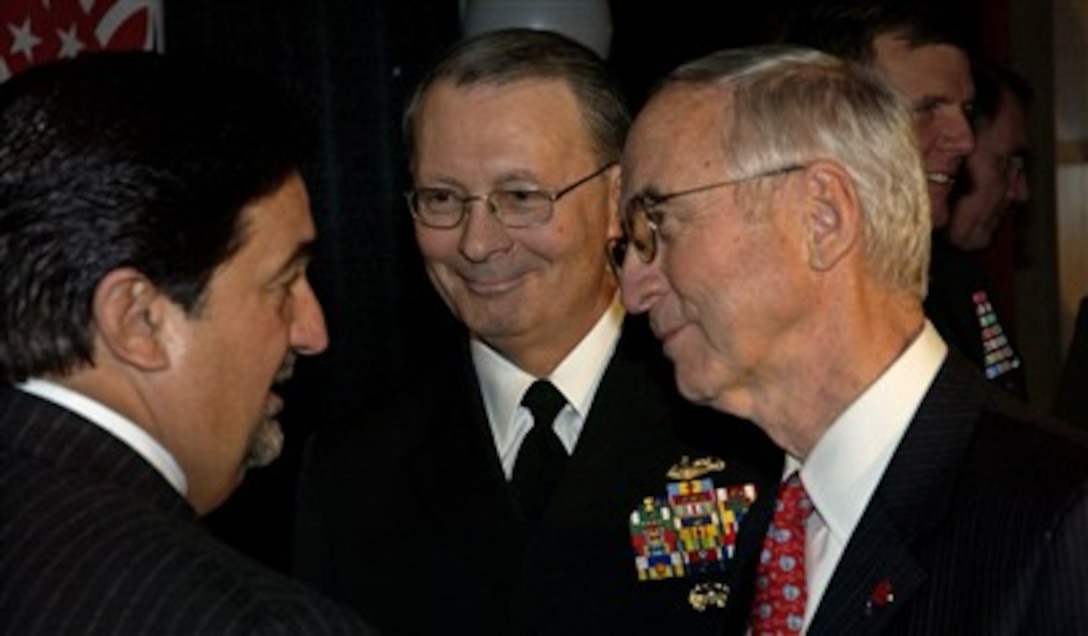 Washington Capitals majority owner Ted Leonis (left) talks with Vice Chairman of the Joint Chiefs of Staff Navy Adm. Edmund P. Giambastiani and Deputy Defense Secretary Gordon England before the team's Military Appreciation Night game, Feb. 8, 2007. The three spoke at a press conference about the organization's committment to supporting the America Supports You program.