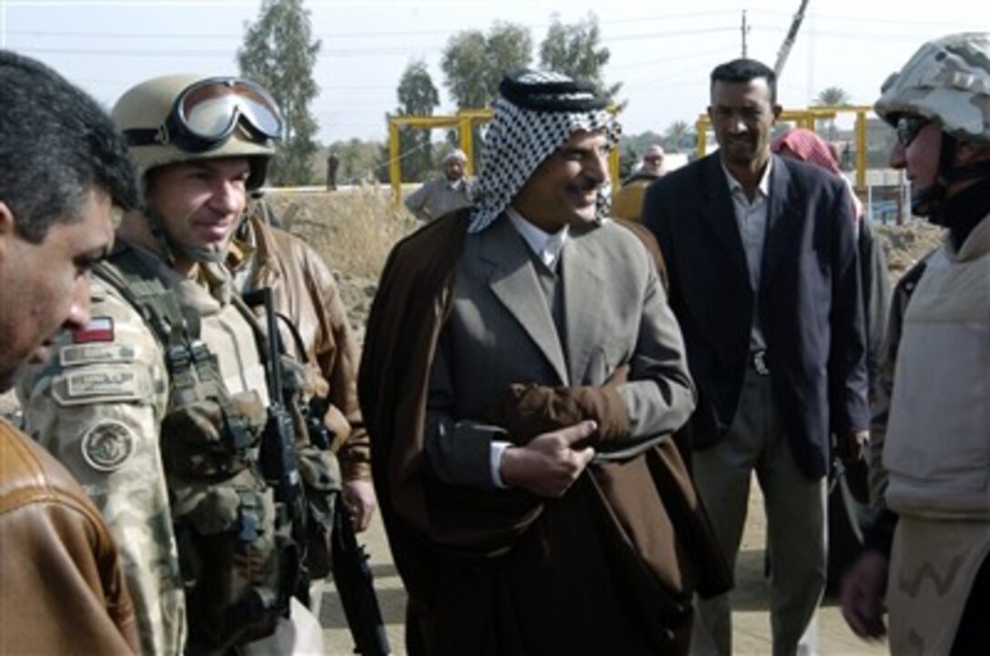 Sheikh Hussein Ali Al-Shaalan greets members of the Polish Civilian Military Cooperation Feb. 5, 2007, in Al Hamzah, Iraq. 