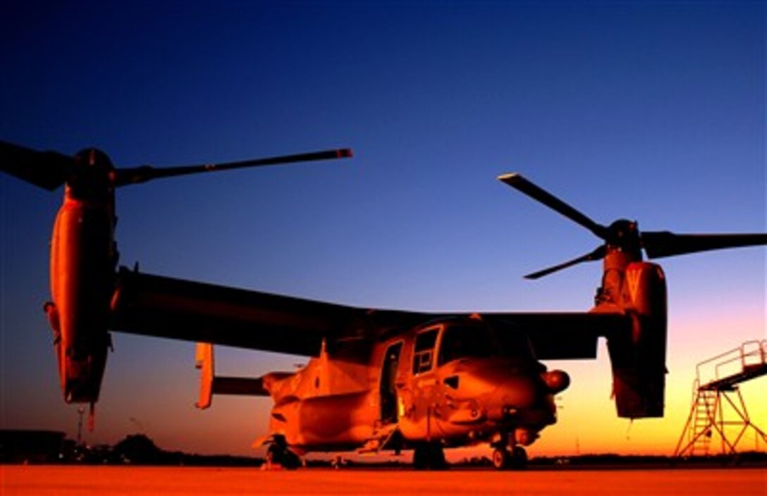 Air Force Special Operations Command's first CV-22 Osprey awaits its next mission on the ramp at Hurlburt Field, Fla., Feb. 8, 2006.  The tilt-rotor Osprey, which has the speed of a conventional airplane and the ability to hover like a helicopter, gives AFSOC warfighters the ability to perform special operations missions.