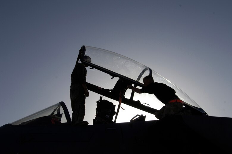 Airmen 1st Class David Muench and Bryen Sandoval perform a post-flight inspection on an F-15 Strike Eagle jet at Bagram Air Base, Afghanistan, in support of Operation Enduring Freedom. (U.S. Air Force photo/Tech. Sgt. Cecilio M. Ricardo Jr.)