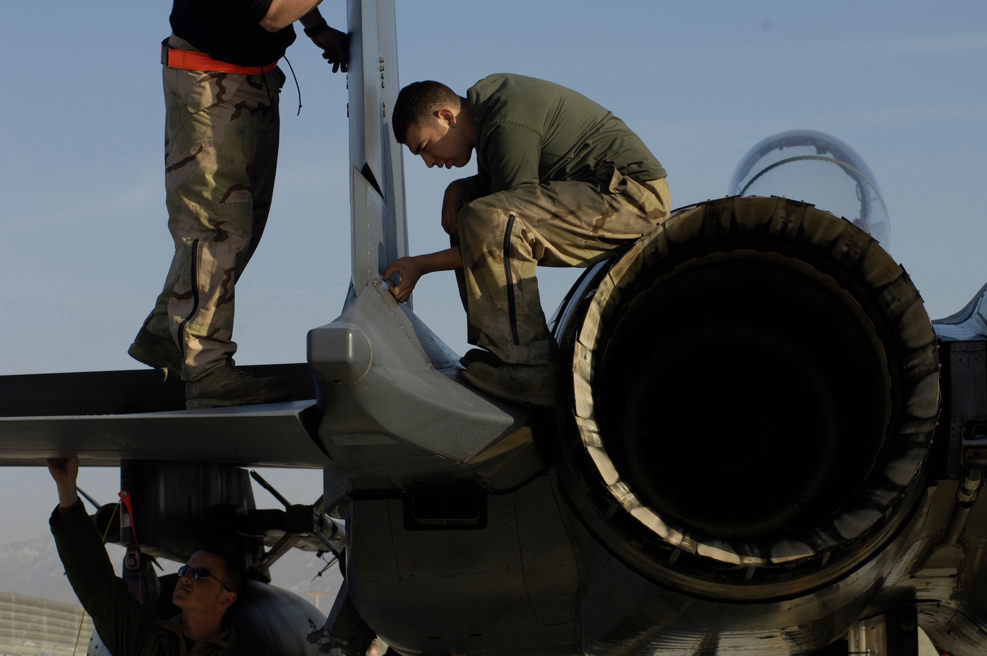 Airmen 1st Class David Muench and Bryen Sandoval perform a post-flight inspection on an F-15 Strike Eagle jet at Bagram Air Base, Afghanistan, in support of Operation Enduring Freedom. (U.S. Air Force photo/Tech. Sgt. Cecilio M. Ricardo Jr.)