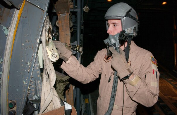 Airman 1st Class Sheldon Cary, 746th Expeditionary Airlift Squadron  loadmaster, performs a pre-flight check on his life support equipment. (U.S. Air Force photo by Airman 1st Class Gustavo Gonzalez)