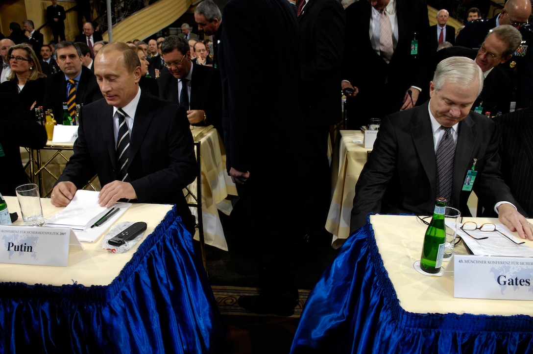 Defense Secretary Robert Gates and Russian president Vladimir Putin take their seats prior to the start of the 43rd Annual Conference on Security Policy in Munich, Germany, Feb. 10, 2007.  The theme for the conference is "Global Crisis-Global Responsibilities." 