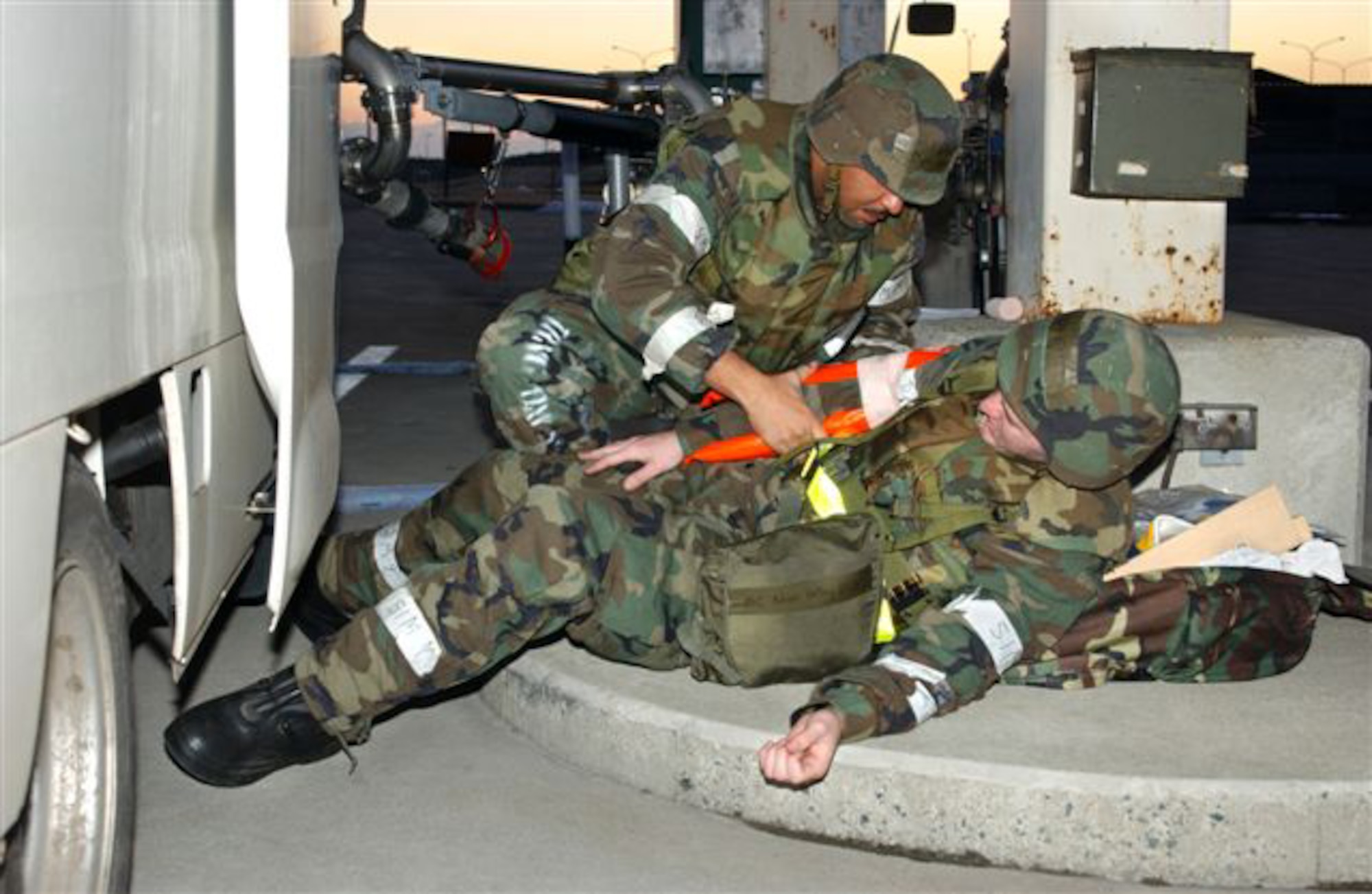 070209-F-5751H-007 MISAWA AIR BASE JAPAN --  Staff Sgt. Isaac Robinson splints Airman First Class Noah Kelley's arm after a simulated accident where he crashed into a fuel stand during an Operational Readiness Exercise at here Feb. 9. Airman Kelley's injury is simulated to test the readiness of the Misawa Airmen during the exercise. Both Airmen are assigned to the 35th Logistics Readiness Squadron. (U.S. Air Force photo by Airman 1st Class Eric Harris)