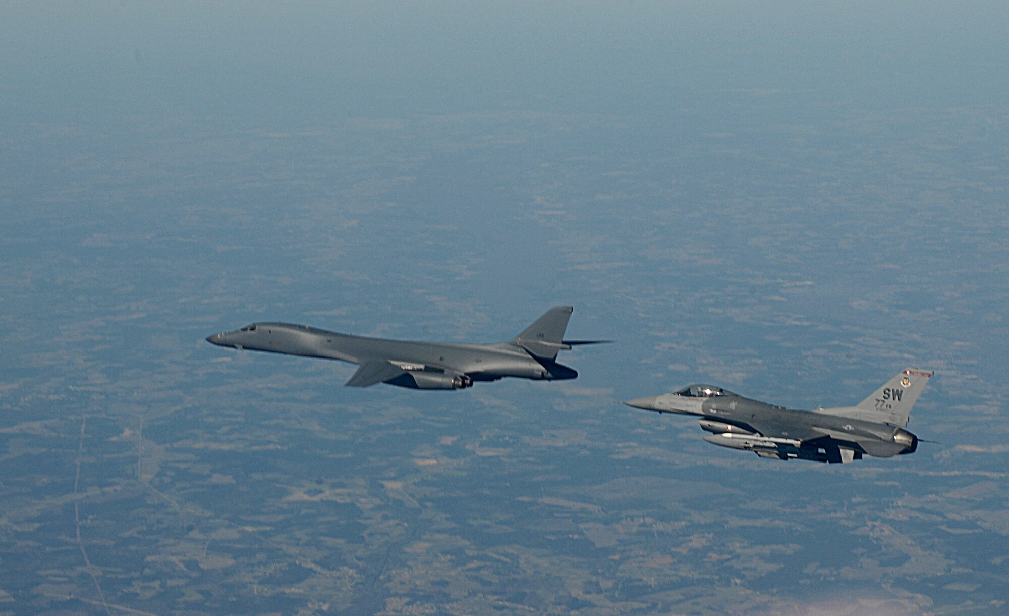 A 77th Fighter Squadron F-16 Fighting Falcon escorts a B-1B Lancer Feb. 7 near Shaw Air Force Base, S.C. during Exercise Iron Thunder, a multi-service, multi-national large force exercise with more than 100 aircraft participating. (U.S. Air Force photo/Staff Sgt Suzanne Day)