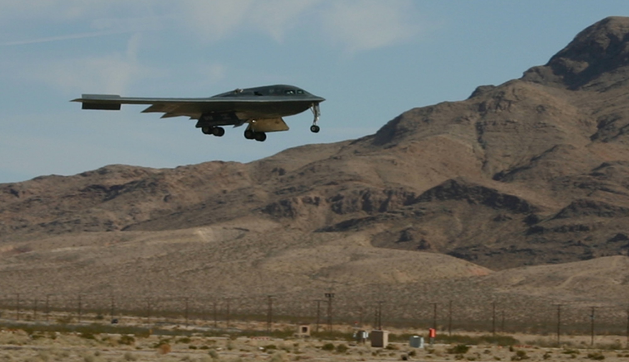 An B-2 Spirit bomber lands at Nellis Air Force Base, Nev., after a Red Flag mission Feb. 12, 2007. All three of the Air Force's stealth aircraft models -- the B-2, F-117 and F-22 -- are taking part in Red Flag, which sharpens aircrews’ war-fighting skills in realistic combat situations. Crews are flying missions during the day and night to the nearby Nevada Test and Training Range where they take part in highly realistic aerial combat. The U.S. Air Force and Navy, along with Australia and the United Kingdom, are participating in February's Red Flag.  (U.S. Air Force photo/Mike Estrada)