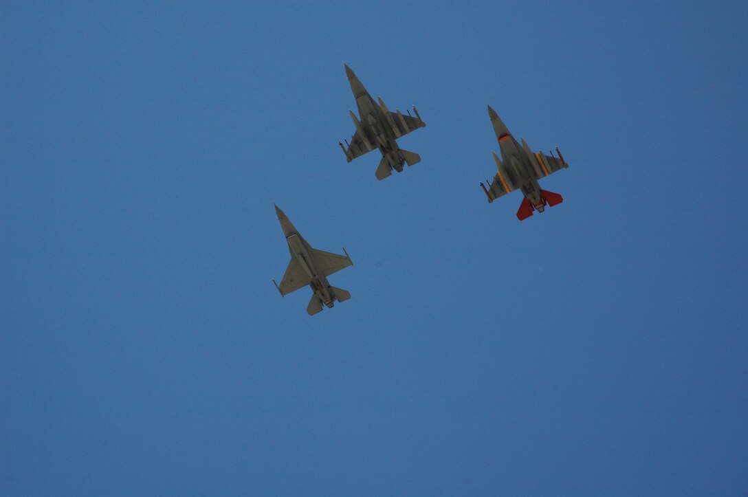 Col. Derek Rydholm, 944th Fighter Wing commander; Lt. Col. Donald Lindberg, 302nd Fighter Squadron commander; and Maj. Mike Sharp, 944th Operations Group deputy commander; perform a ceremonial flyover above the Luke Air Force Base flightline Feb. 12, 2007, as hundreds of unit members bid farewell to the unit's remaining F-16s. The last three of 17 F-16s assigned to the 944th Fighter Wing departed the base and will be reassigned as part of Base Realignment and Closure actions. Two of the final F-16s will go to Nellis Air Force Base, Nev., and will become part of the aggressor squadron. The third will go to an Air National Guard unit in Tucson, Ariz. (U.S. Air Force photo/Staff Sgt. Susan Stout)