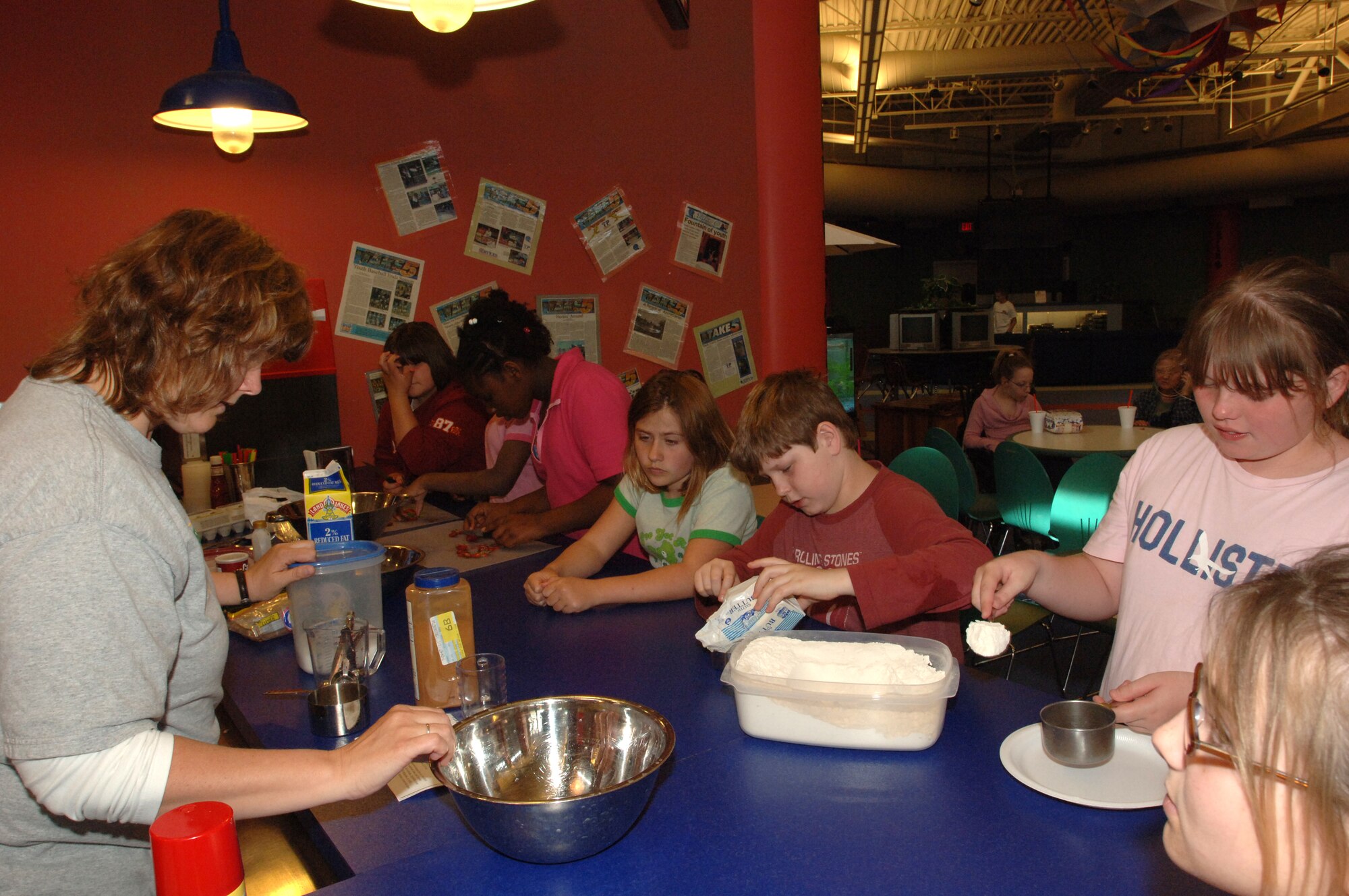 MINOT AIR FORCE BASE, N.D. -- Children help make baked goods during cooking class at the David C. Jones Youth Center here.  The David C. Jones Youth Center was recently selected Best Youth Center in Air Combat Command for 2006.