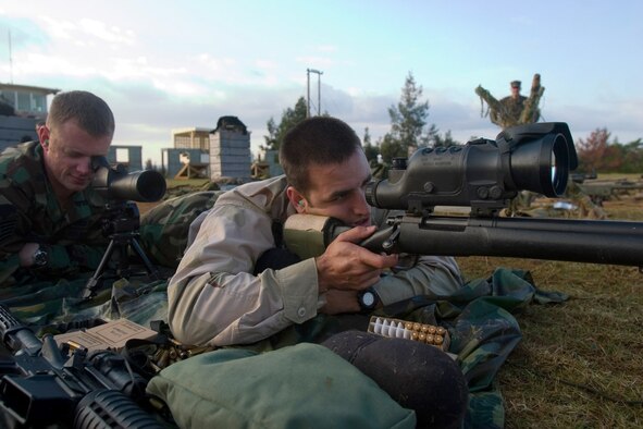 Staff Sgt. Samuel Howell (spotter) and Staff Sgt. Patrick Pendergest (sniper) train at the Urban Sniper School in January at Kadena Air Base, Japan. They were the first two Airmen to attend Kadena AB?s Marine sniper school. They both are from the 736th Security Forces Squadron from Andersen Air Force Base, Guam. (U.S. Marine Corps photo/Cpl. Kamran Sadaghiani)
