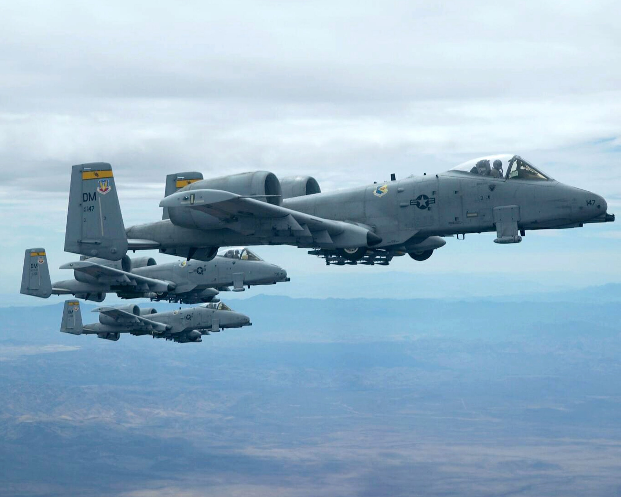Three A-10 Thunderbolt IIs fly in formation. A-10s provided close-air support for a scout team that received small arms fire Feb. 11 near Balad, Iraq. The A-10s observed the team apprehend the individuals responsible for the small arms fire and provided reconnaissance until the team returned to their forward-operating base. (U.S. Air Force photo/Senior Airman Christina D. Ponte)

