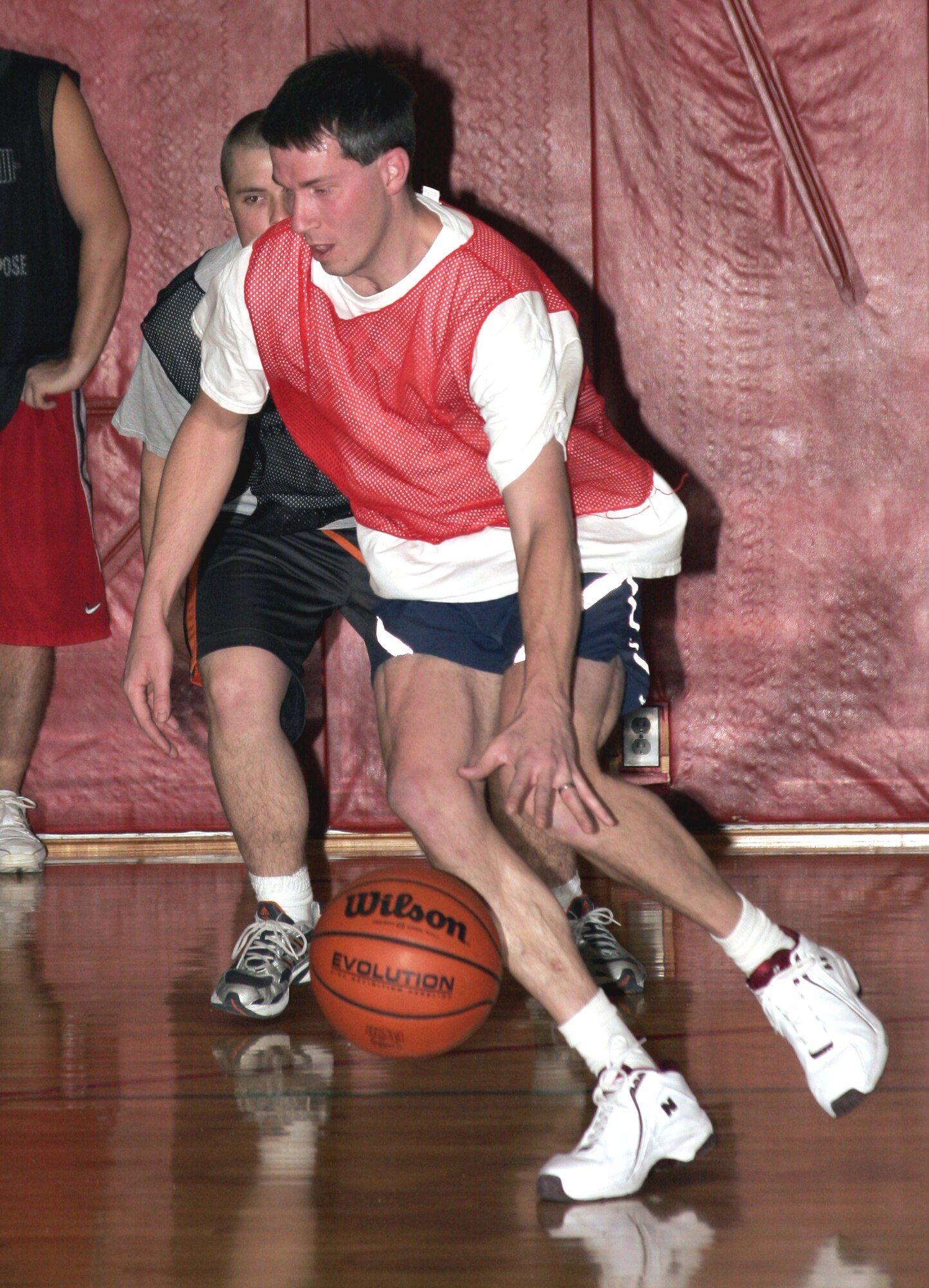 GRISSOM AIR RESERVE BASE, Ind.-- Ben Durr, 434th Security Forces Squadron, looks for an opening during a match up with the 434th Logistics Readiness Squadron, during the annual basketball tournament. The cops were handcuffed during the game with having only four players, but played tough before falling 49-48 on a last second shot by LRS's Brandon Williams. (U.S. Air Force photo/Senior Airman Omar Delacruz)