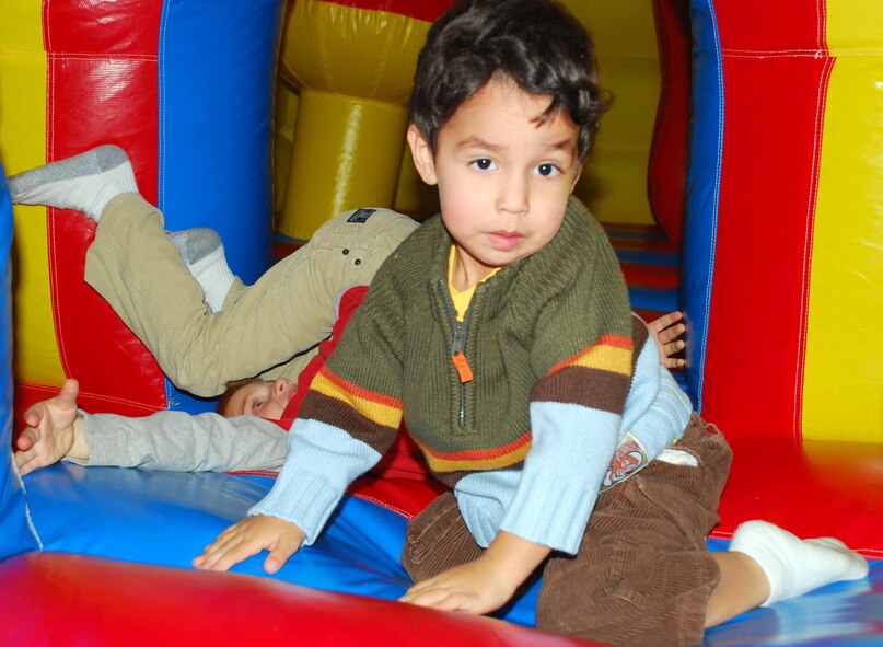 Kenneth Briere and Tanner Mills enjoy the Moonbounce at the Gary Michael Holloway Military Housing Carnival Feb. 10. GMH sponsored the free event at the Community Center from 1-5 p.m. for the base housing residents. (U.S. Air Force photo/Tech. Sgt. Jennifer Isom) 