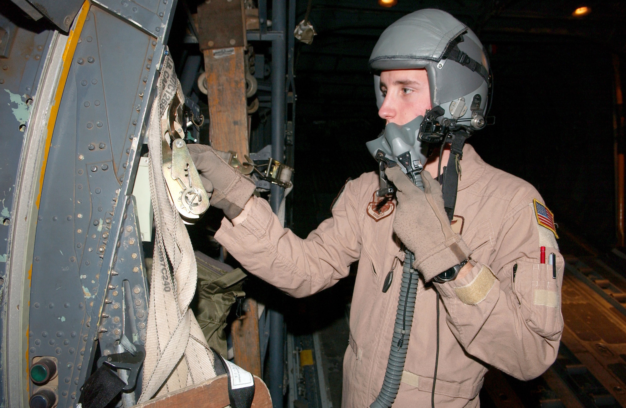 Airman 1st Class Sheldon Cary performs a pre-flight check on his life support equipment Feb. 6 in Southwest Asia. He is a loadmaster assigned to the 746th Eexpeditionary Airlift Squadron. (U.S. Air Force photo/Airman 1st Class Gustavo Gonzalez) 
