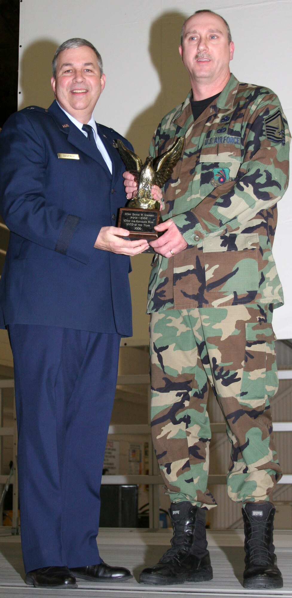 GRISSOM AIR RESERVE BASE, Ind., -- Brig. Gen. Dean Despinoy, left, 434th Air Refueling Wing Commander, presents Senior Master Sgt. David Simpson, 49th Aerial Port Flight, a plaque in recognition of his selection as the Wing's Senior NCO of the Year for  2006. (U.S. Air Force photo/Senior Airman Omar Delacruz)