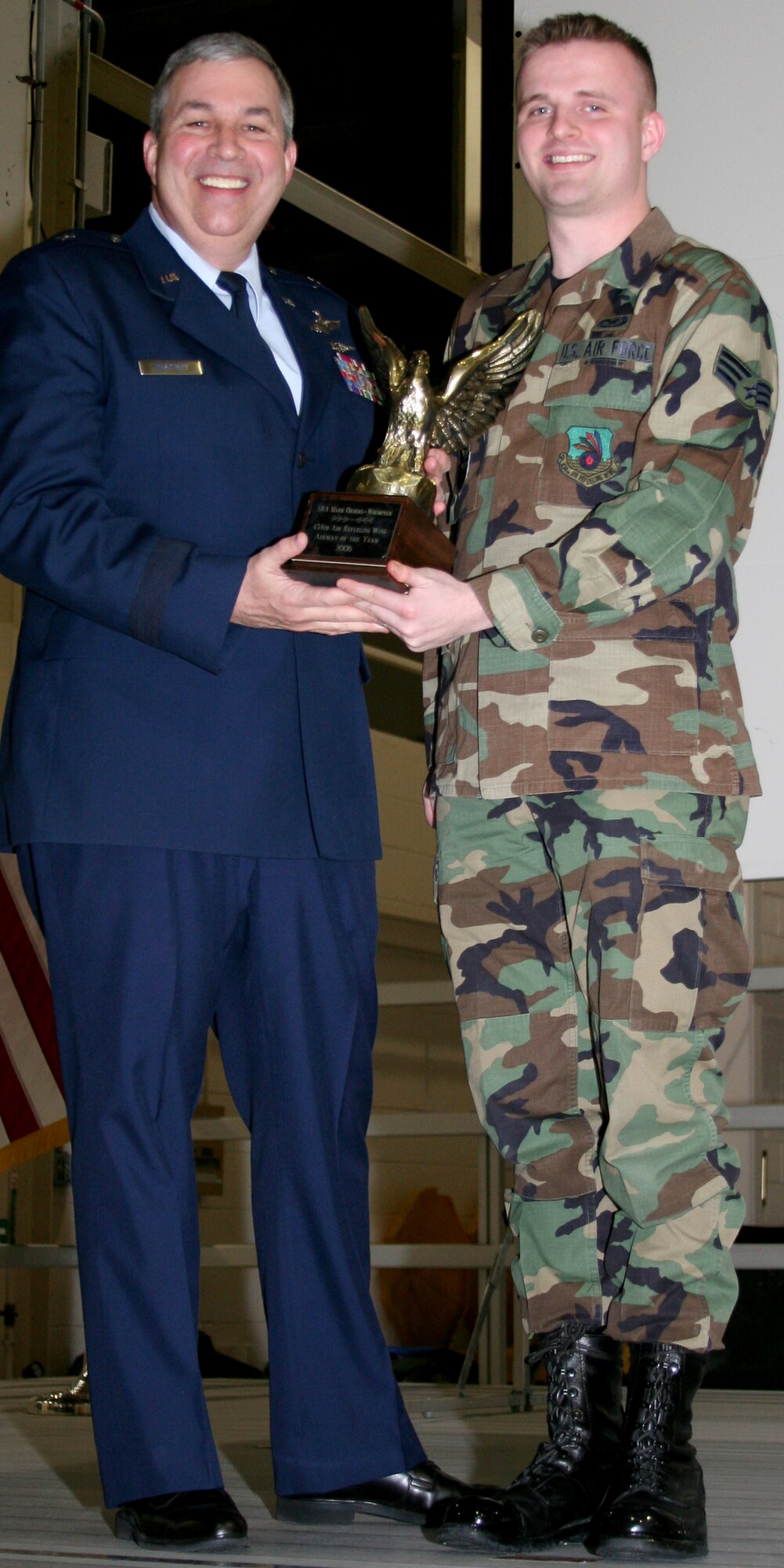 GRISSOM AIR RESERVE BASE, Ind., -- Brig. Gen. Dean Despinoy, left, 434th Air Refueling Wing Commander, presents Senior Airman Mark Orders-Woempner, 434th ARW Public Affairs specialist, a plaque in recognition of his selection as the Wing's Airman of the Year for  2006. (U.S. Air Force photo/Senior Airman Omar Delacruz)