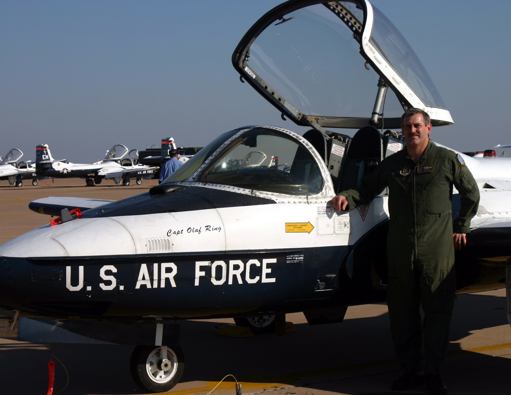 Major Jim Kuehn, a flight safety officer with the 80th Flying Training Wing and T-37 instructor pilot with the 97th Flying Training Squadron, stands by the T-37 he flew his 3,000th hour in Feb. 5 (U.S. Air Force photo/Airman 1st Class Jacob Corbin).