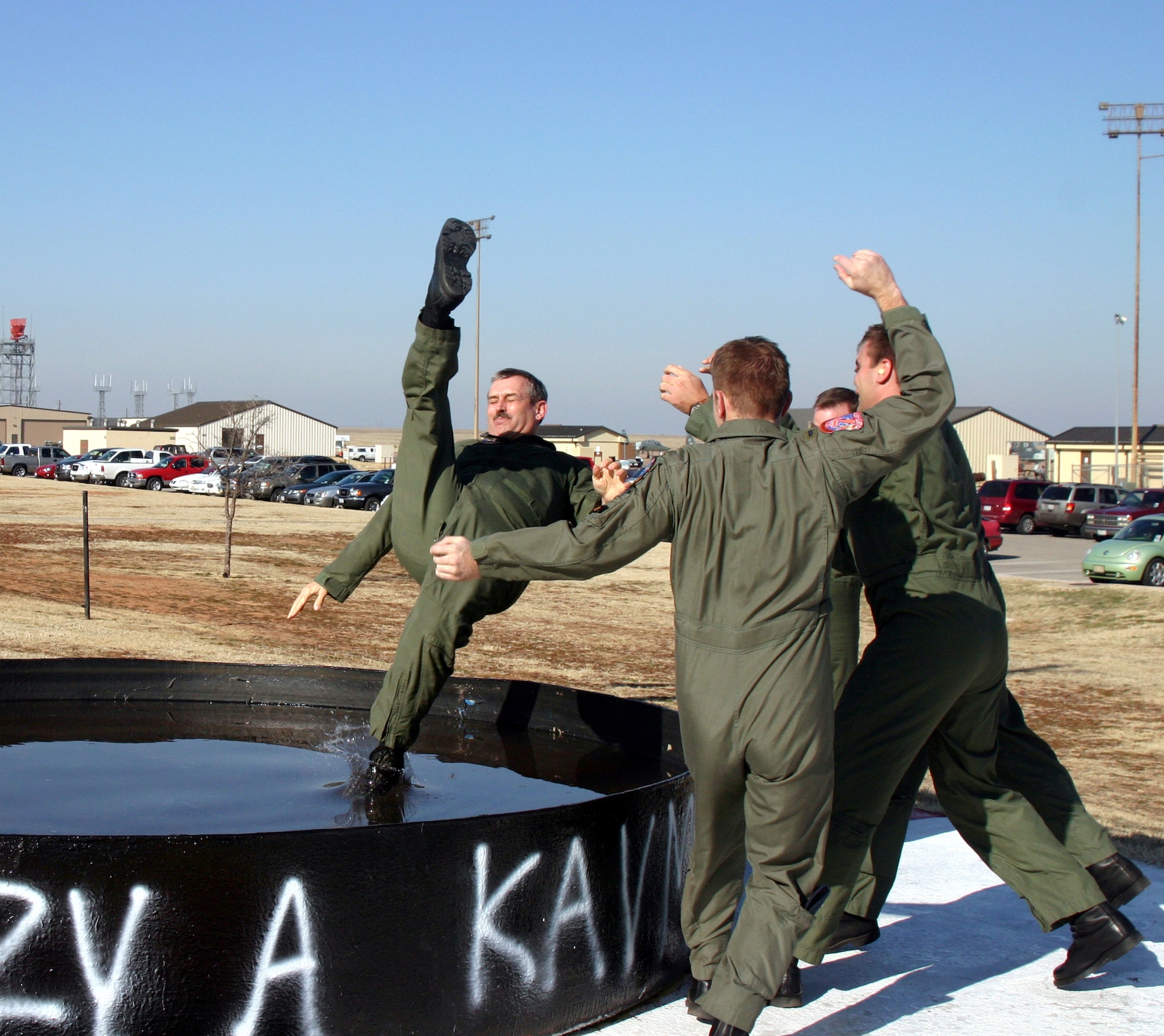 Major Jim Kuehn, a flight safety officer with the 80th Flying Training Wing and T-37 instructor pilot with the 97th Flying Training Squadron, gets tossed into the dunk tank after completing his 3,000th flying hour in a Tweet Feb. 5 (U.S. Air Force photo/Airman 1st Class Jacob Corbin).