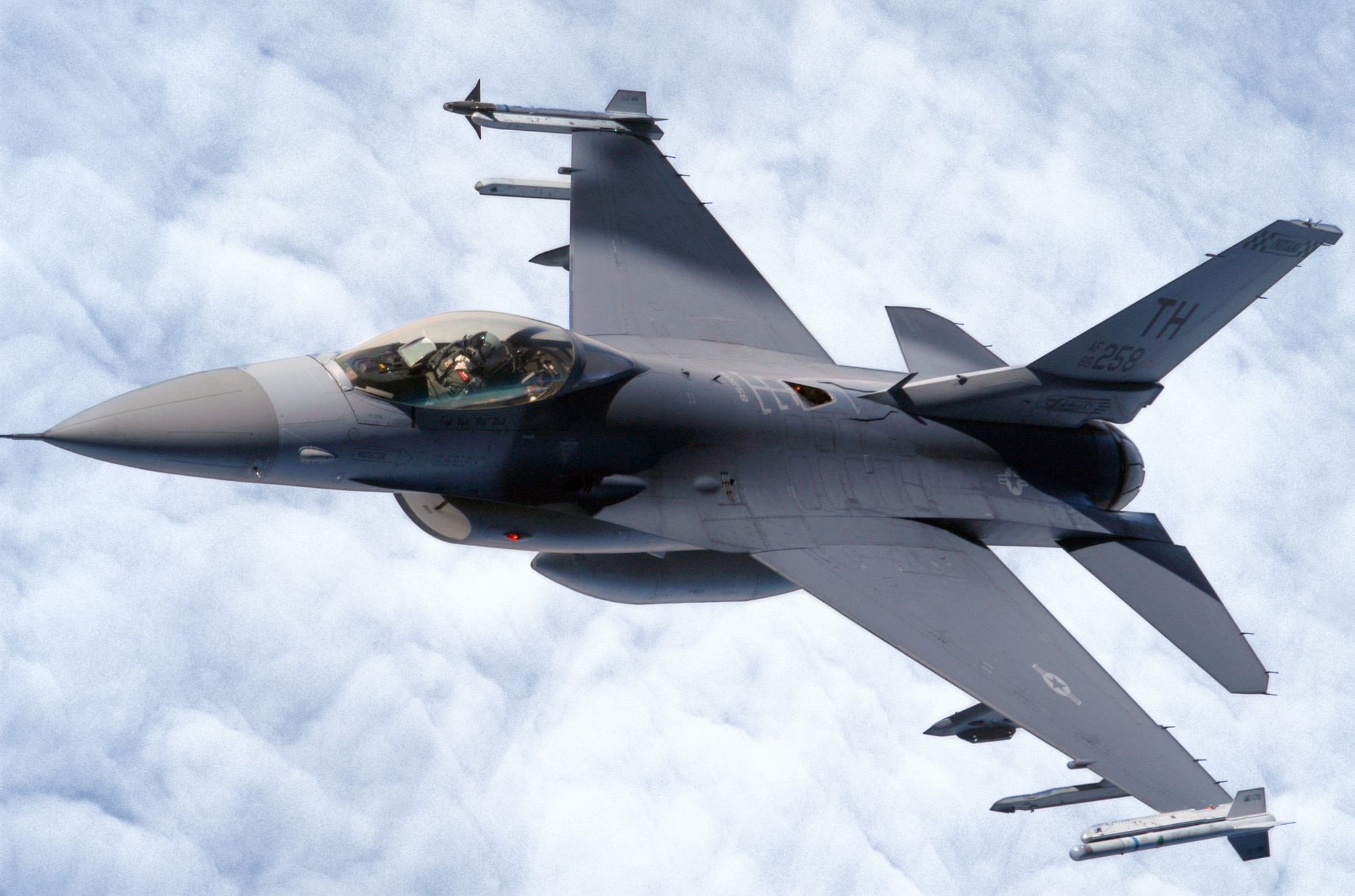 GRISSOM AIR RESERVE BASE, Ind., -- An F-16 Fighting Falcon from the 181sth Fighter Wing at Terre Haute, Ind., rolls out following a disconnect with a KC-135R Stratotanker from the 434th Air Refueling Wing during a recent aerial refueling mission. The KC_135R Stratotanker is able to provide midair refuelings to fighter, bomber and cargo aircraft.  (U.S. Air Force photo/Senior Airman Mark Orders-Woempner)