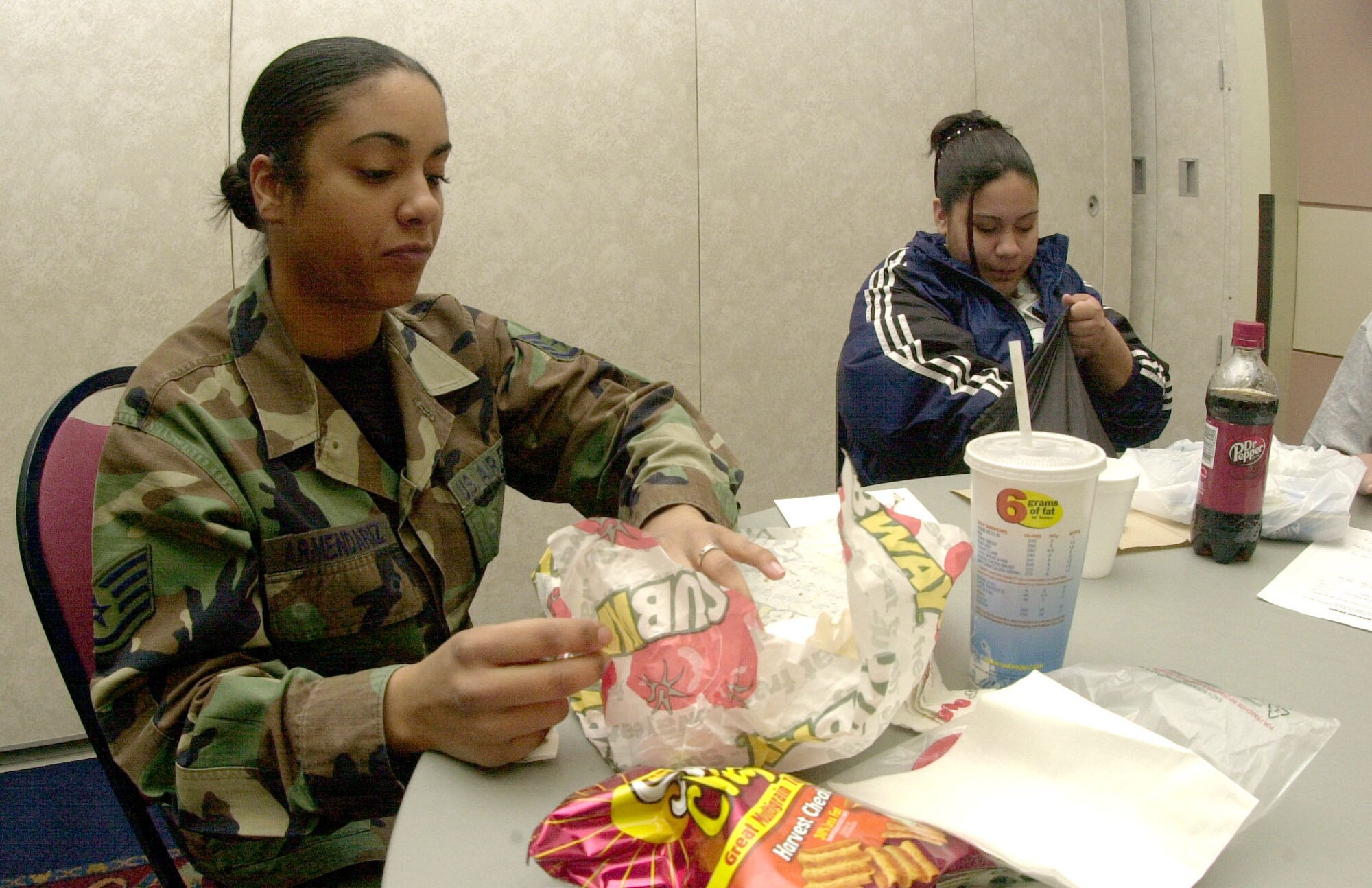 Staff Sgt. Alisha Armendariz, 17th Medical Operations Squadron, spends her lunch time with 15-year-old Ashley Hernandez, a Lakeview High School freshman, who shadowed Sgt. Hernandez to learn more about pediatrics. (U.S. Air Force photo by Airman 1st Class Luis Loza Gutierrez)