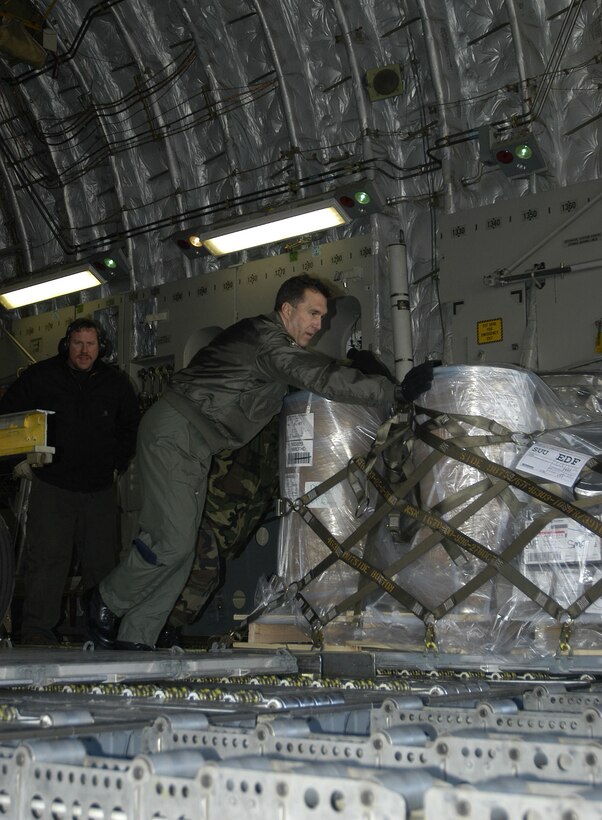 Senior Master Sgt. Randy Munroe, 317 AS, Charleston AFB, S.C., offloads pallets at Elmendorf AFB, AlaskA during a recent Pacific Express mission.                