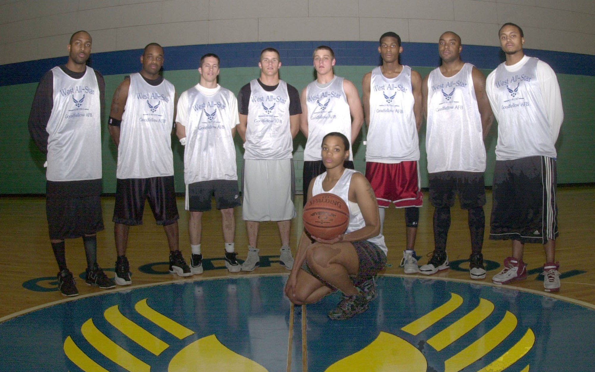 Western Conference All-Stars in no particular order: Brian Samuel, Sid Walker, Andre Golden, Cameron Townsend, Moshe Dawkins, Tiegess Jones, Woodrow Rorie and No. 33 Zehler. (U.S. Air Force photo by Airman 1st Class Luis Loza Gutierrez)