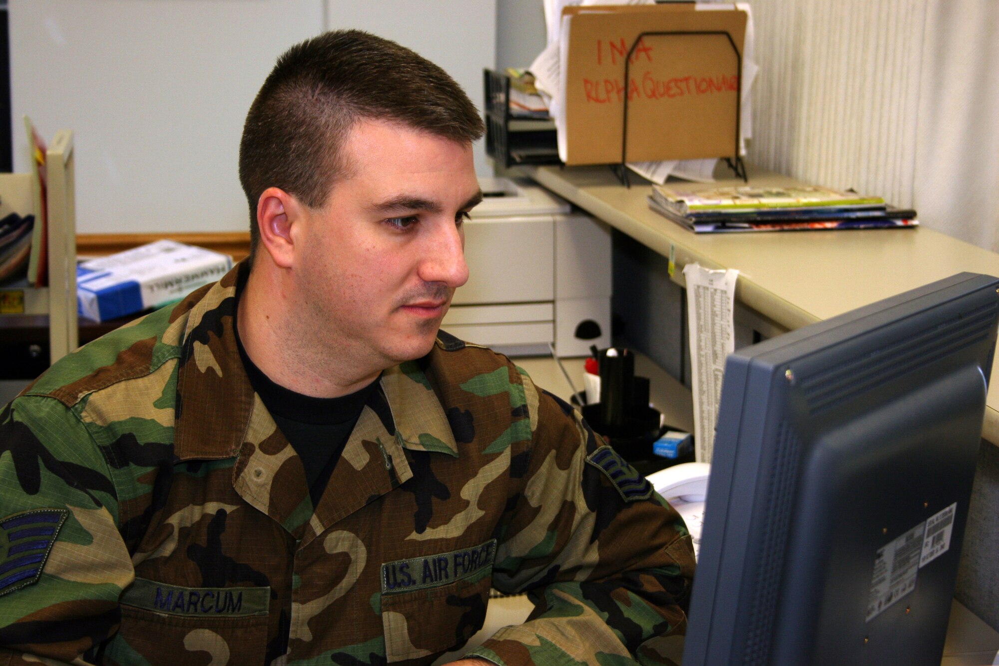 GRISSOM AIR RESERVE BASE, Ind.--Tech Sgt. Brad Marcum, an aeromedical craftsman with the 434th Aerospace Medice Squadron, reviews the status of a physical exam using a data tracking network system. This database has streamlined the process of medical exams at the clinic at Grissom, which conducts more than 50 physicals per day during main UTAs. (U.S. Air Force photo/Senior Airman Omar Delacruz)