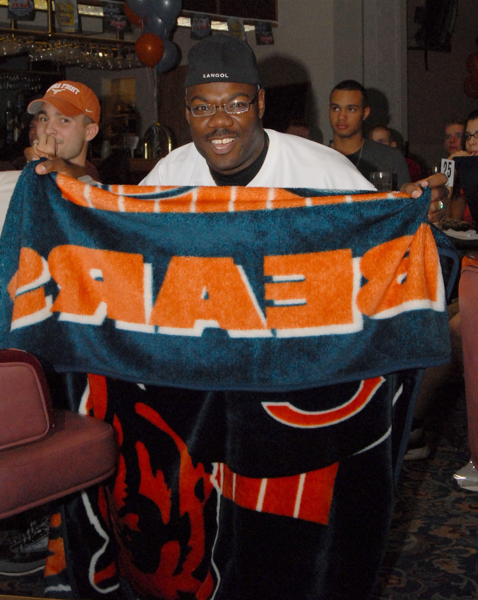 Master Sgt. Reginald Booker, a member of the 82nd Training Wing, Sheppard Air Force Base, Texas, displays his loyalty to the Chicago Bears during the Super Bowl party. (U.S. Air Force photo by Airman 1st Class Luis Loza Gutierrez.)