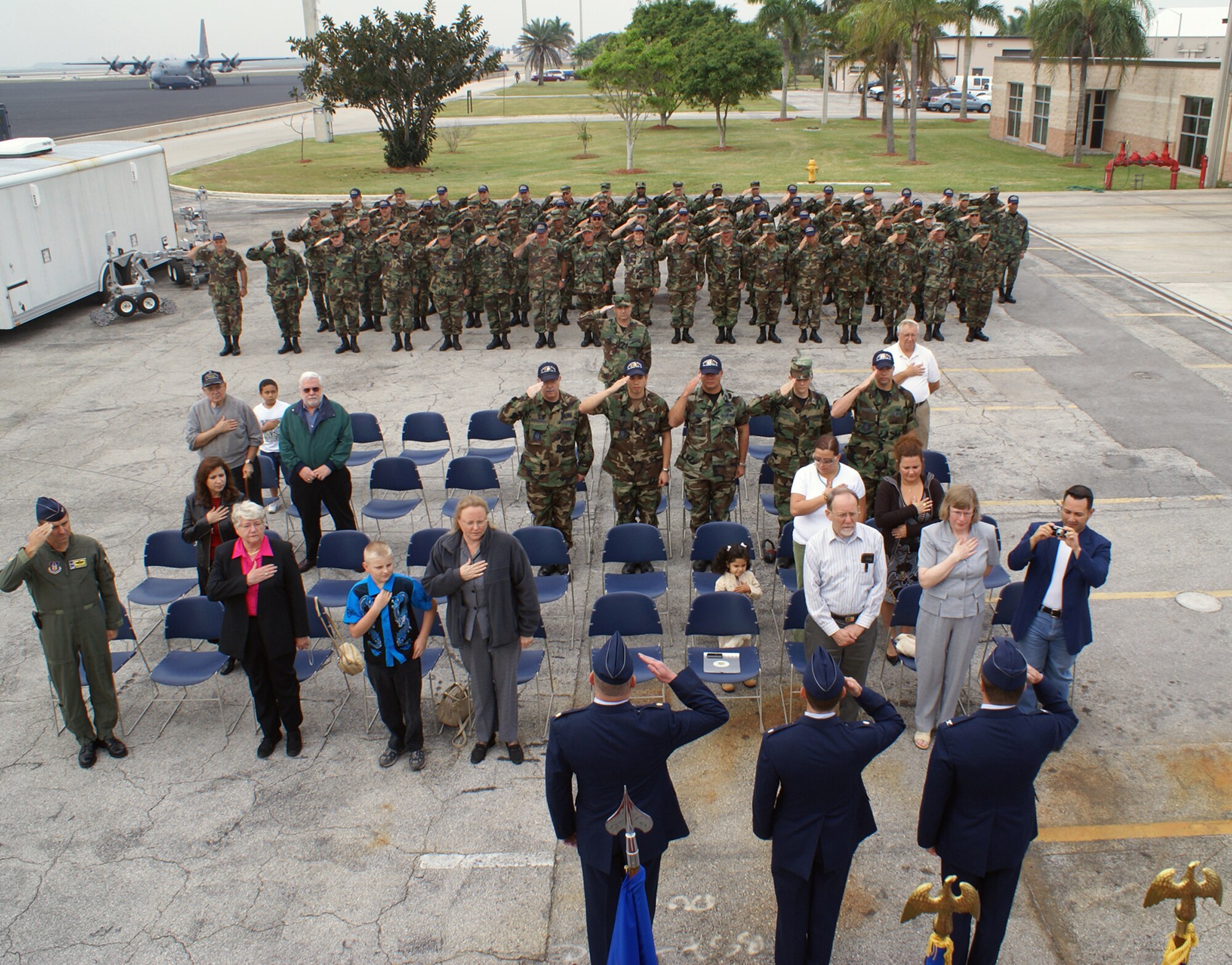 Members of the 482nd Civil Engineering Squadron salute during a change of command ceremony here at Homestead Air Reserve Base Feb. 11.  During the ceremony, Lt. Col. Mark Wolfe relinquished command of the squadron to Maj. William S. Riehl, III.   Lt. Col. Wolfe is retiring after six years as the CES commander. (U.S. Air Force photo/Jake Shaw)