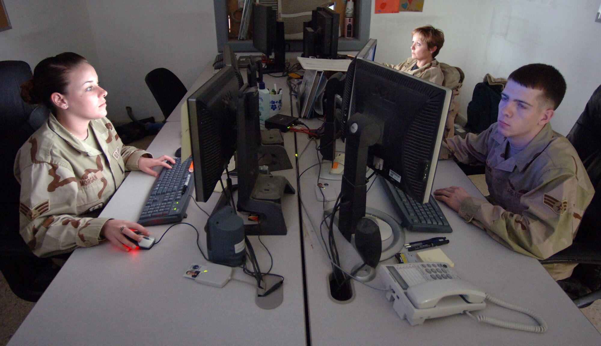Balad Air Base, Iraq--Airmen from the 332nd Expeditionary Communications Squadron Network Administraion office regulate and manage network permissions and security for the network at Balad Air Base.  (U. S. Air Force photo by Staff Sgt. Michael R. Holzworth) (Released) 