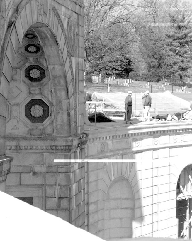 Construction continues in front and behind the 
walls of the Arlington National Cemetery hemicycle wall -- site 
of the Women in Military Service for America Memorial. The wall's 
restoration will not begin until builders complete most of the 
memorial's interior. Master Sgt. Stephen Barrett, USA