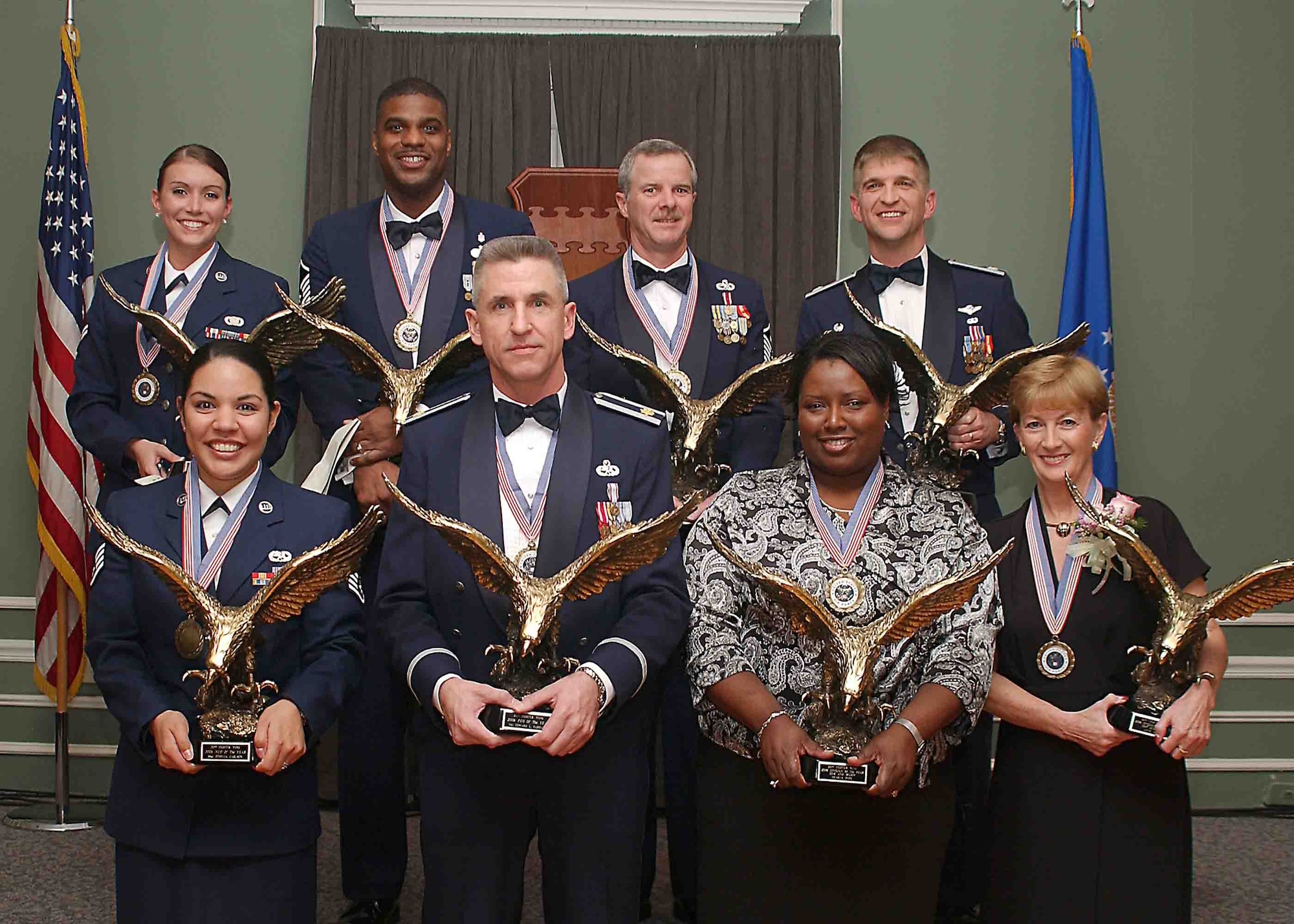 SHAW AIR FORCE BASE, S.C. -- The 20th Fighter Wing presents its annual award winners Feb. 9 at a ceremony in Carolina Skies. First row, from left: Staff Sgt. Othelia Carlson, 20th Communications Squadron, 20th FW NCO of the Year; Maj. Edward Earhart, 20th Equipment Maintenance Squadron, 20th FW Field Grade Officer of the Year; Sharla Pope, 20th Comptroller Squadron, 20th FW Civilian Employee of the Year for GS-6 or WG-7 employees and below, and Anne Baker, 20th Contracting Squadron, 20th FW Civilian Employee of the Year for GS-7 or WG- 8 employees and above. Second row, from left: Airman 1st Class Crystal Moore, 20th Security Forces Squadron, 20th FW Airman of the Year; Master Sgt. James Powell III, 20th Aeromedical-Dental Squadron, 20th FW Senior NCO of the Year; Master Sgt. John Walker, 20th SFS, 20th FW First Sergeant of the Year, and Lt. Col. Stephen Higgins, 20th Medical Group deputy commander, accepting the 20th FW Company Grade Officer of the Year award on behlaf of Capt. Kourtney Shaw, 20th AMDS. (U.S. Air Force photo/Staff Sgt. Nathan Brevier)

                               