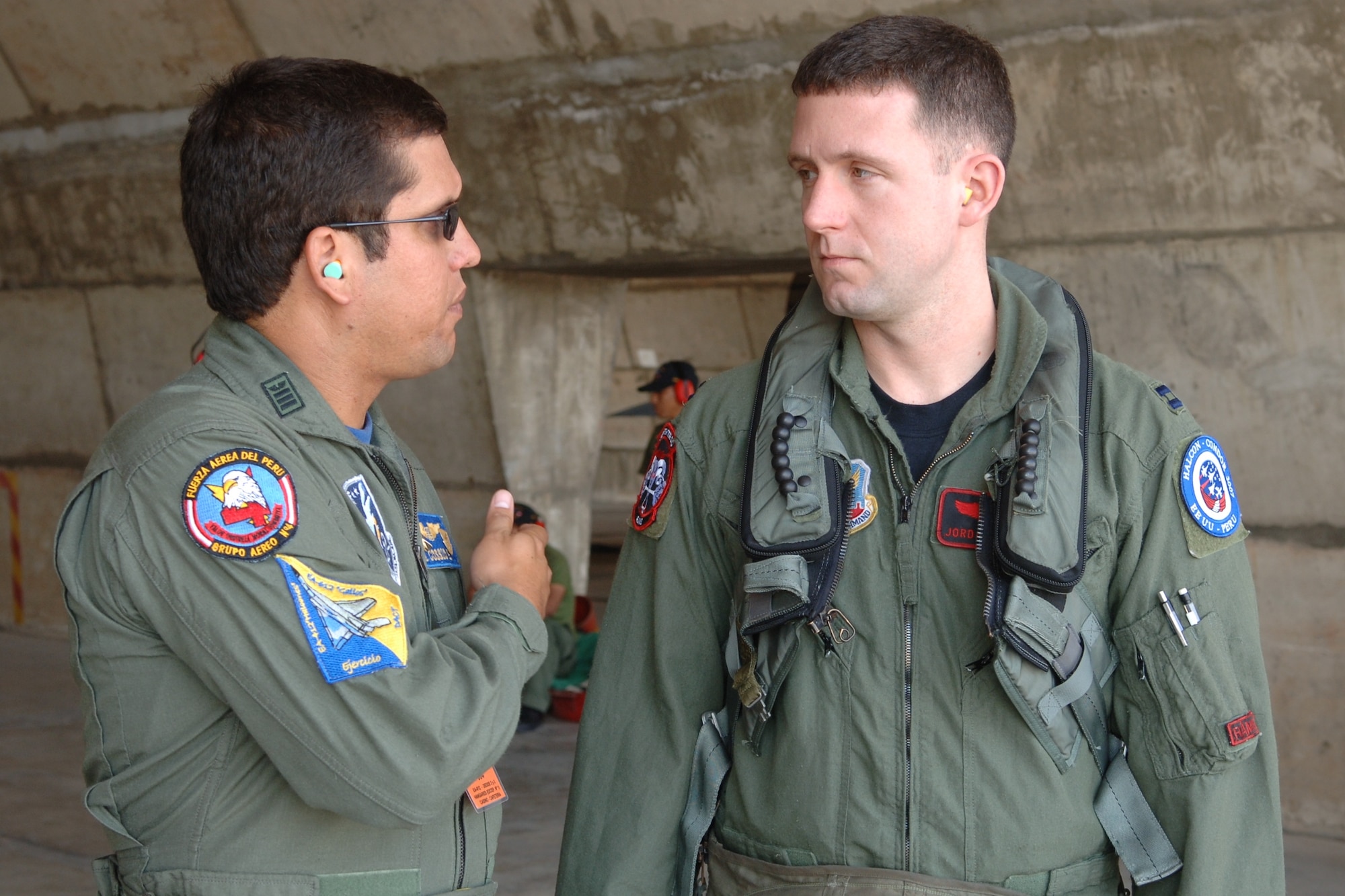 Capt. Jordan Carvell (right) discusses pre-flight instructions with Peruvian Lt. Col. Antonio Cossion during Exercise Falcon Condor 07 before flying in a Peruvian Mirage 2000. The exercise allows the U.S military to build relationships with military and civilian leaders of Peru. Captain Carvell is a pilot assigned to the 34th Fighter Wing at Hill Air Force Base, Utah. (U.S. Air Force photo/Staff Sgt. Lee Hoover)