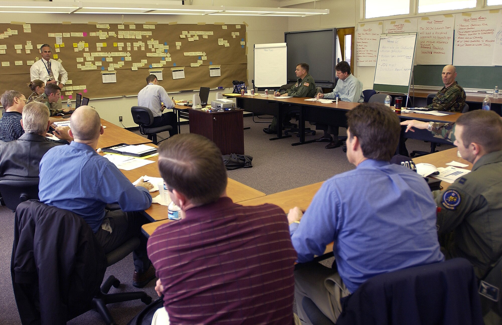 John Sadauskas, facilitator of the Air Force Smart Operations for the 21st Century team 3, addresses a group of contractors, civilians and military personnel, to streamline the processes it takes to prepare for each missile launch on Vandenberg.(U.S. Air Force photo by Airman 1st Class Ashley Tyler)