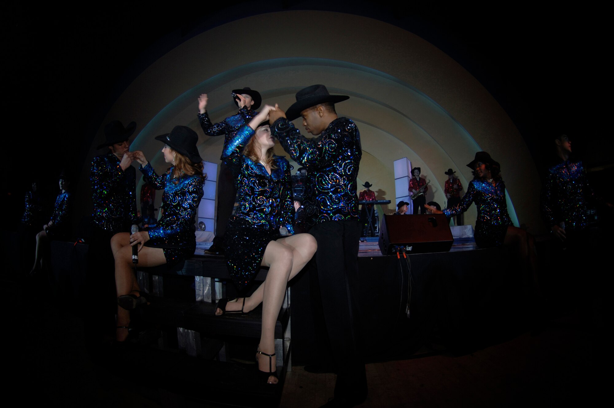 Members of Tops In Blue perform at the Cotillion Ballroom in Wichita, Kan. Jan. 31. Members of McConnell Air Force Base and the surrounding community enjoyed the free show despite cold weather conditions. Tops In Blue perform in various locations including hostile locations for deployed members. (Air Force photo by Senior Airman Jamie Train, 22nd Communications Squadron) 
