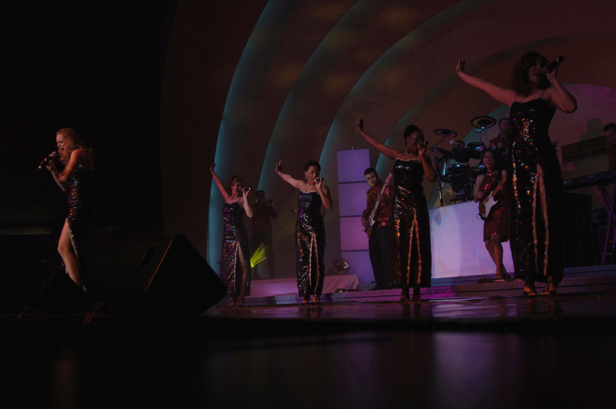 Senior Airman Bethany Schwartzkopf a performer from the 2006 Tops In Blue world tour, sings at the Cotillion Ballroom in Wichita, Kan. Jan. 31. Members of McConnell Air Force Base and the surrounding community enjoyed the free show despite cold weather conditions. Tops In Blue perform in various locations including hostile locations for deployed members. (Air Force photo by Senior Airman Jamie Train, 22nd Communications Squadron) 