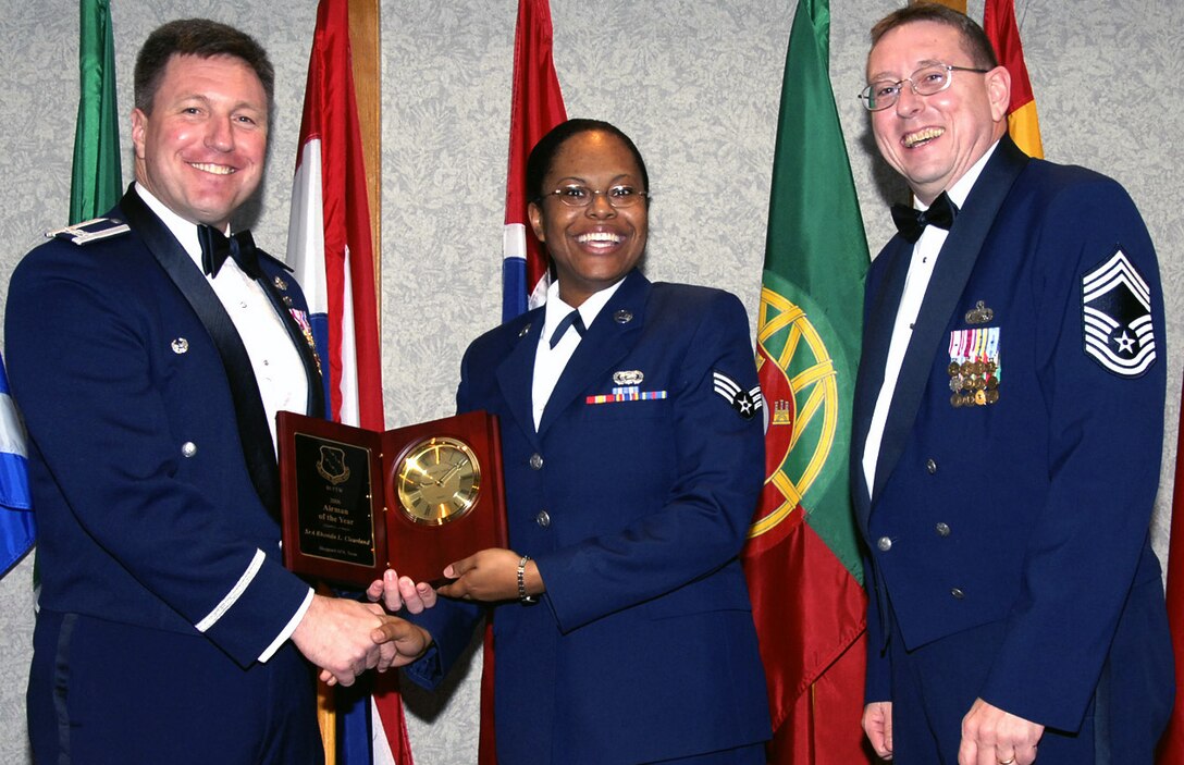 Senior Airman Rhonda Cleavland, center, is the 80th Flying Training Wing's 2006 Airman of the Year. The 90th Flying Training Squadron assumed all responsibilities of the squadron's standardization and evaluation requirements. She also volunteered to assist in the T-38 instructor program in the squadron. Airman Cleavland is pursuing an associates degree from Vernon College and is an active member in her church, including youth choir director. Also picture, left, 80th FTW Commander Jeffrey Kendall and Chief Master Sgt. Norman Thierolf, 80th FTW superintendent. (U.S. Air Force photo/Harry Tonemah)