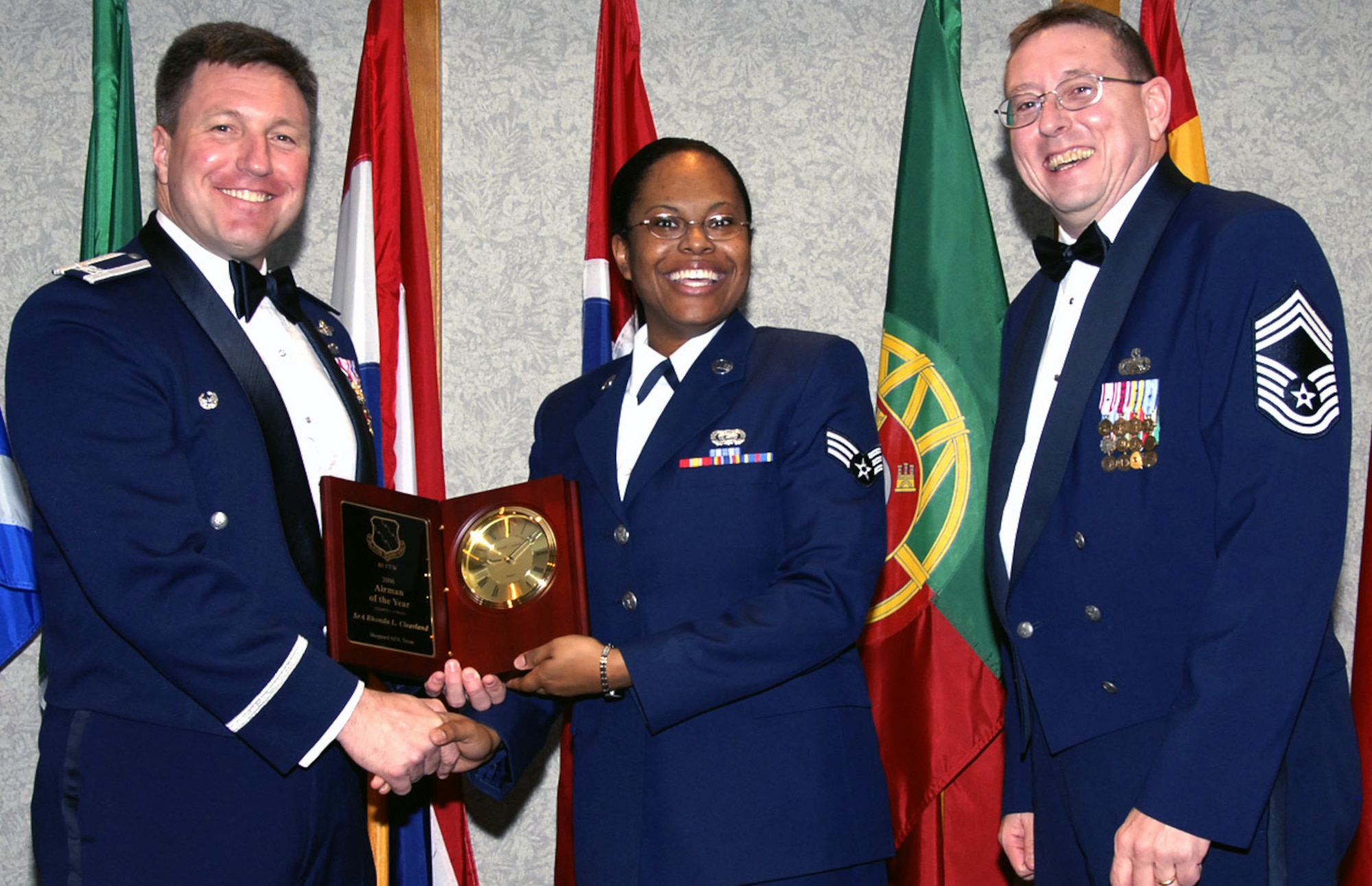 Senior Airman Rhonda Cleavland, center, is the 80th Flying Training Wing's 2006 Airman of the Year. The 90th Flying Training Squadron assumed all responsibilities of the squadron's standardization and evaluation requirements. She also volunteered to assist in the T-38 instructor program in the squadron. Airman Cleavland is pursuing an associates degree from Vernon College and is an active member in her church, including youth choir director. Also picture, left, 80th FTW Commander Jeffrey Kendall and Chief Master Sgt. Norman Thierolf, 80th FTW superintendent. (U.S. Air Force photo/Harry Tonemah)